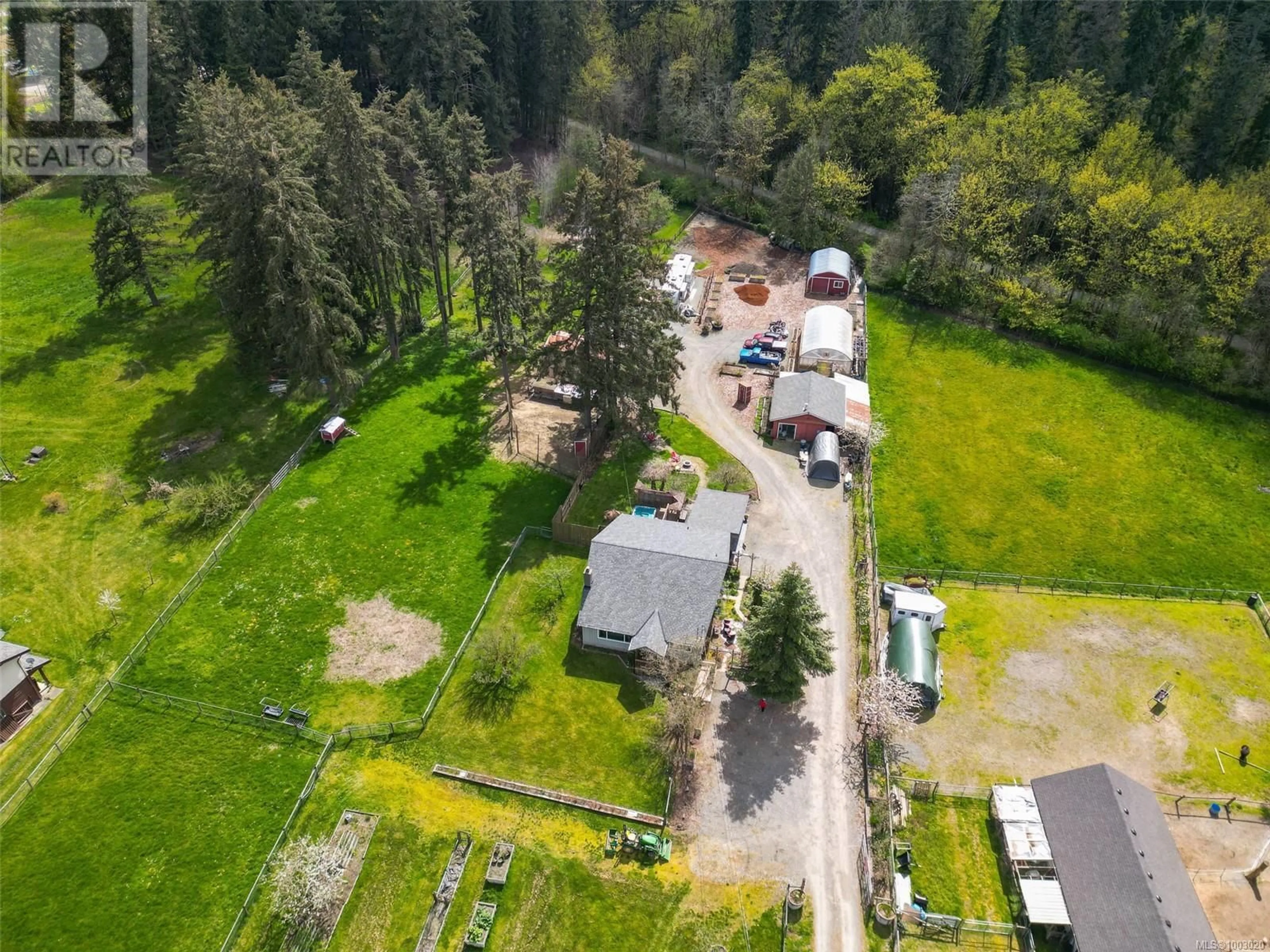 A pic from outside/outdoor area/front of a property/back of a property/a pic from drone, forest/trees view for 3574 COWICHAN LAKE ROAD, Duncan British Columbia V9L6K5