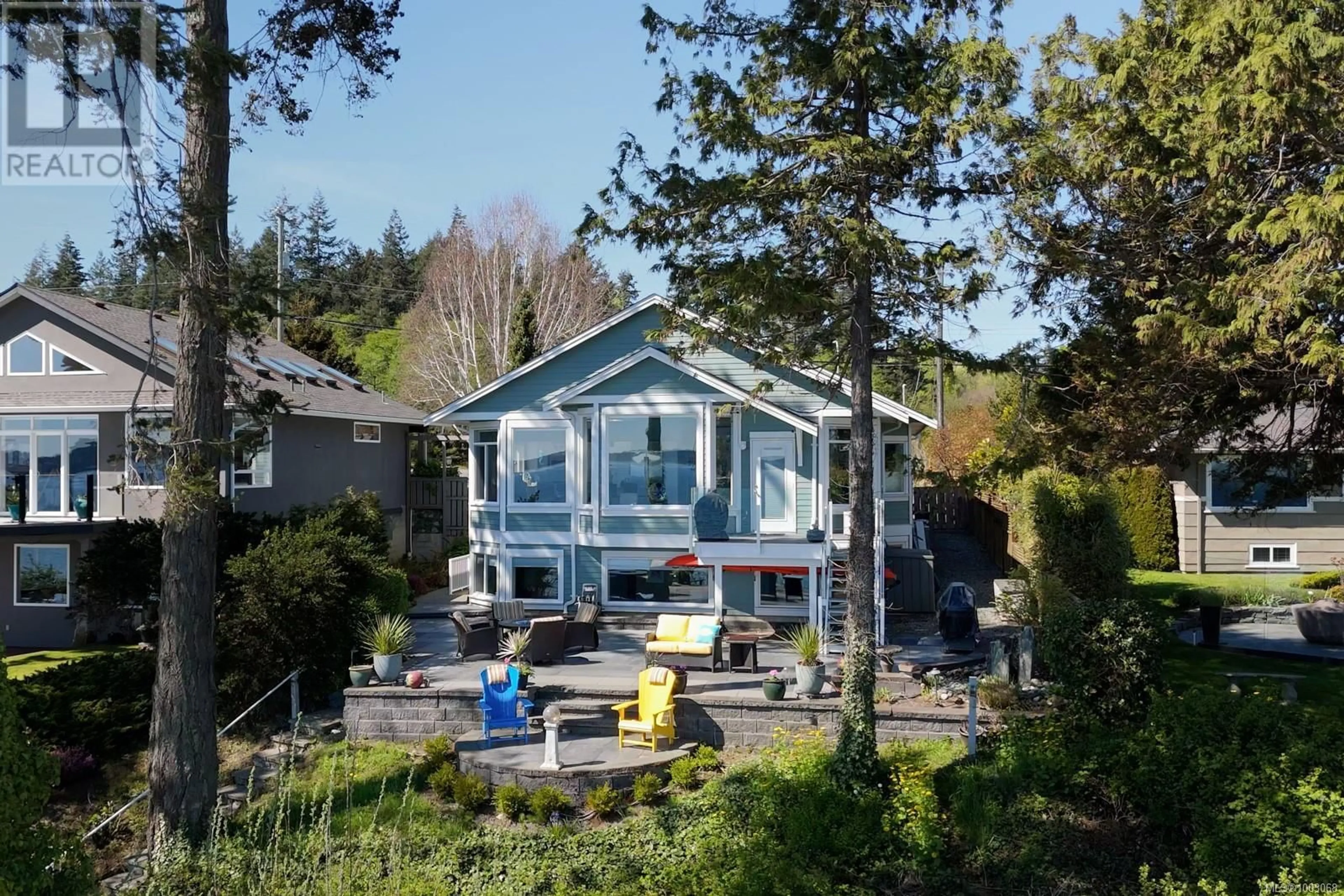 A pic from outside/outdoor area/front of a property/back of a property/a pic from drone, mountain view for 9055 LOCHSIDE DRIVE, North Saanich British Columbia V8L1N1