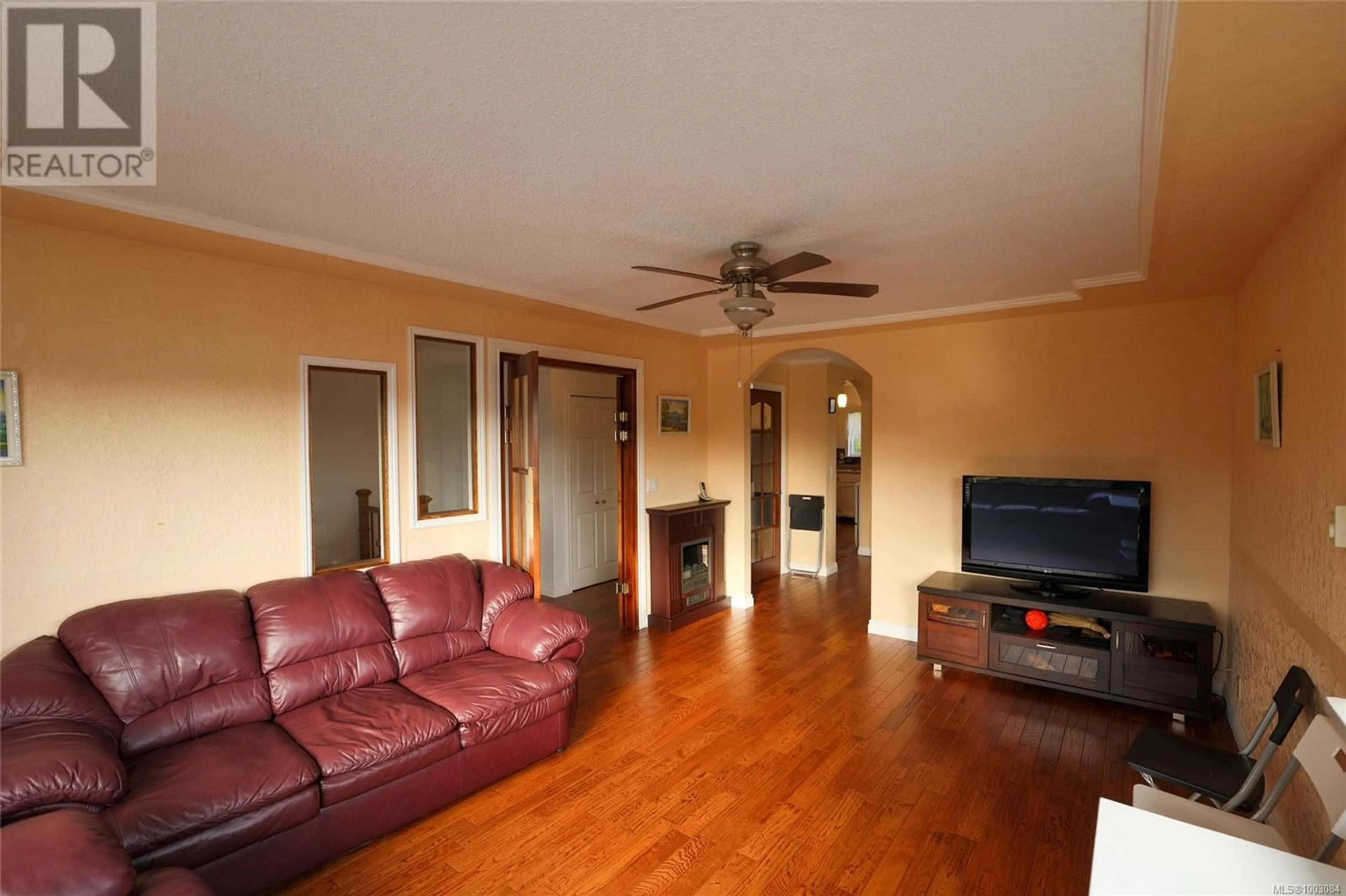 Living room with furniture, wood/laminate floor for 8840 DOUGLAS STREET, Port Hardy British Columbia V0N2P0