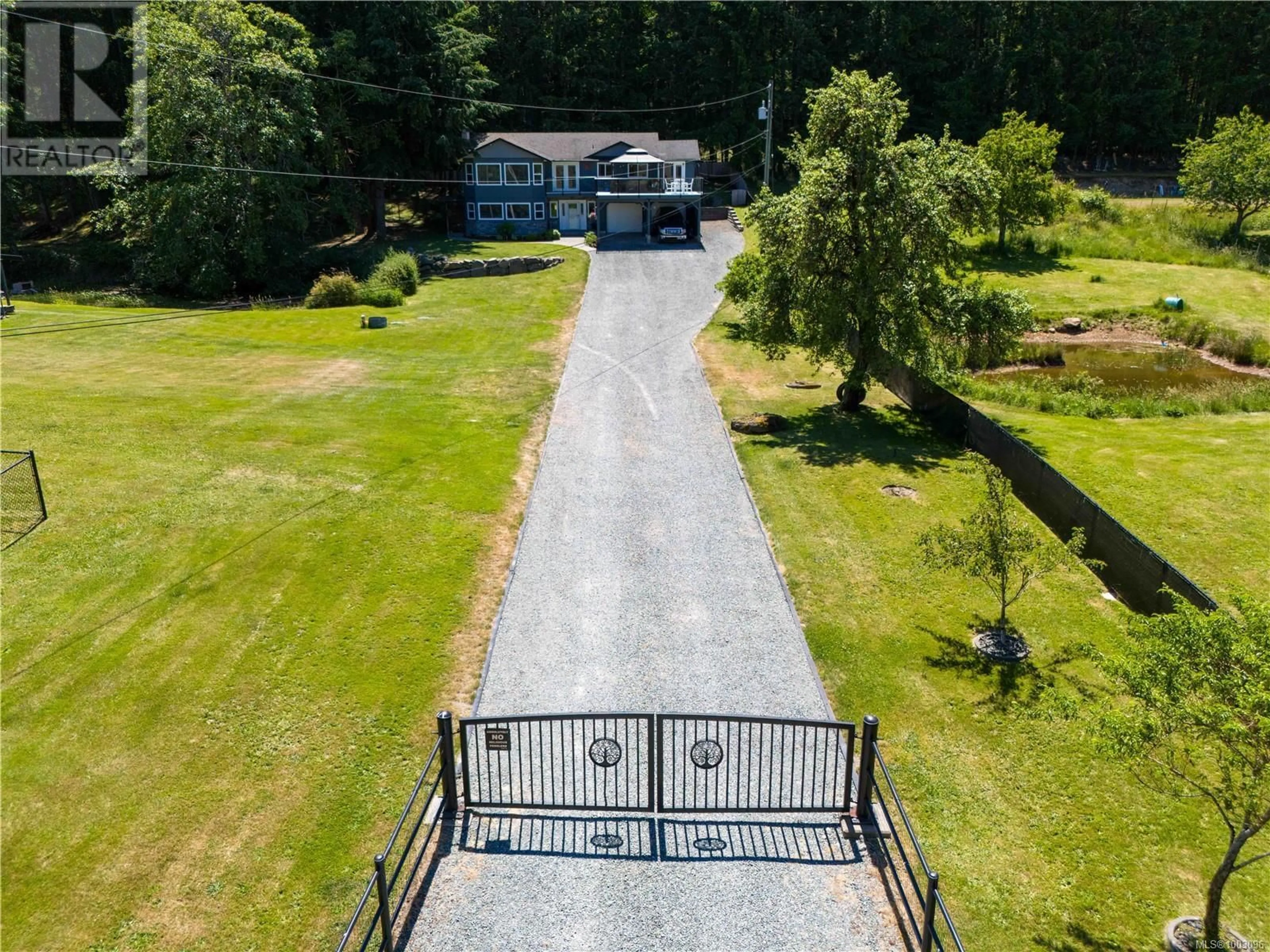 A pic from outside/outdoor area/front of a property/back of a property/a pic from drone, street for 2701 JINGLE POT ROAD, Nanaimo British Columbia V9R6W5