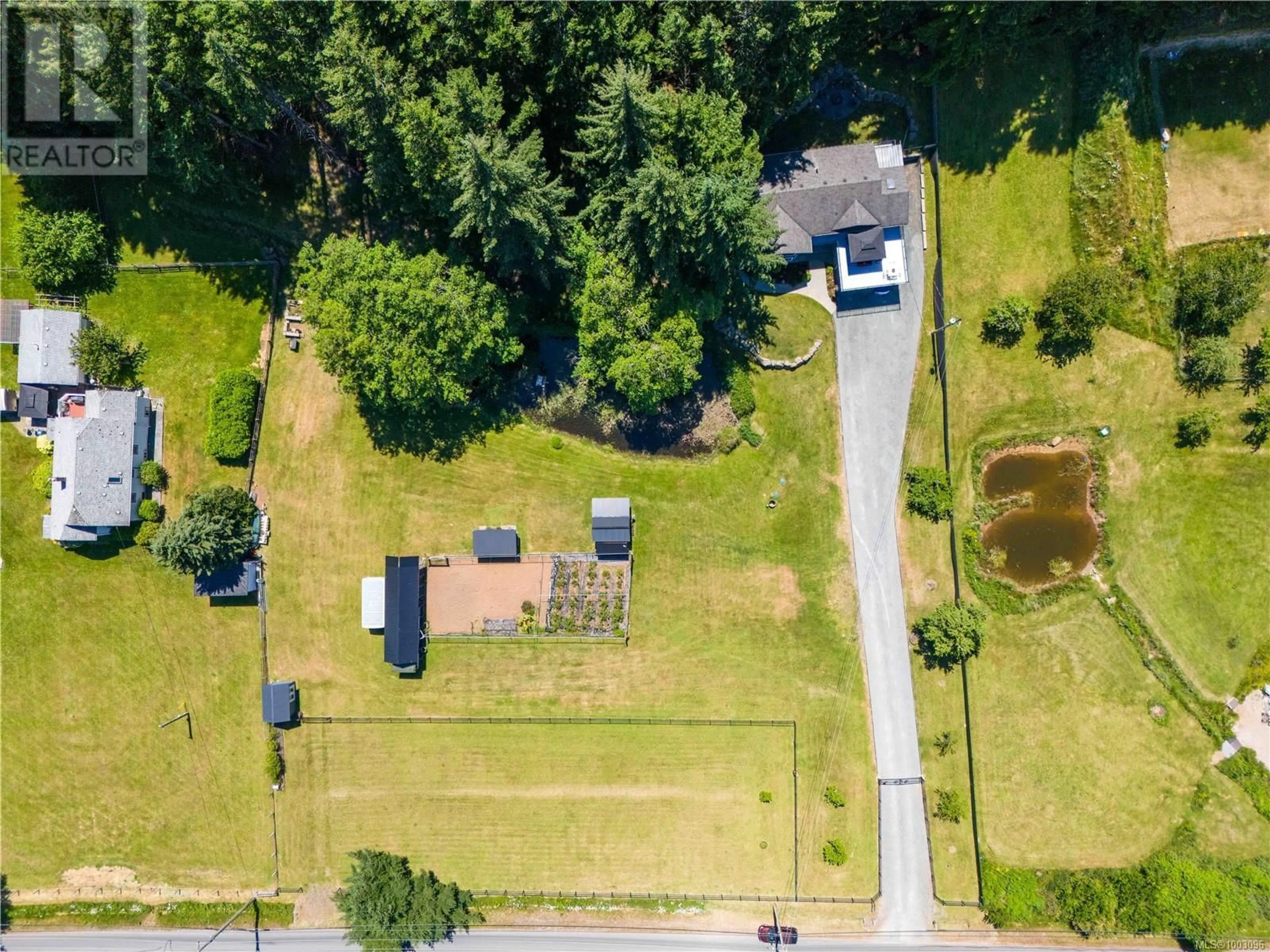 A pic from outside/outdoor area/front of a property/back of a property/a pic from drone, street for 2701 JINGLE POT ROAD, Nanaimo British Columbia V9R6W5