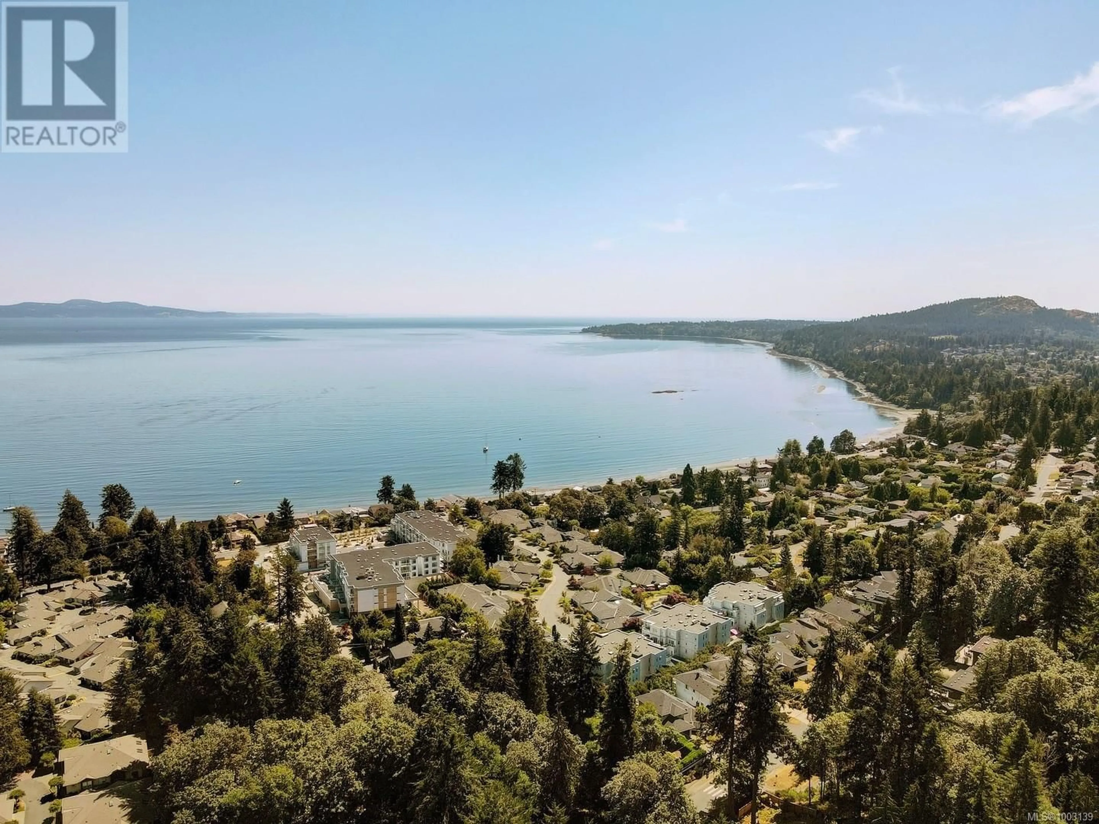 A pic from outside/outdoor area/front of a property/back of a property/a pic from drone, water/lake/river/ocean view for 302 - 986 DOUMAC AVENUE, Saanich British Columbia V8Y1M4