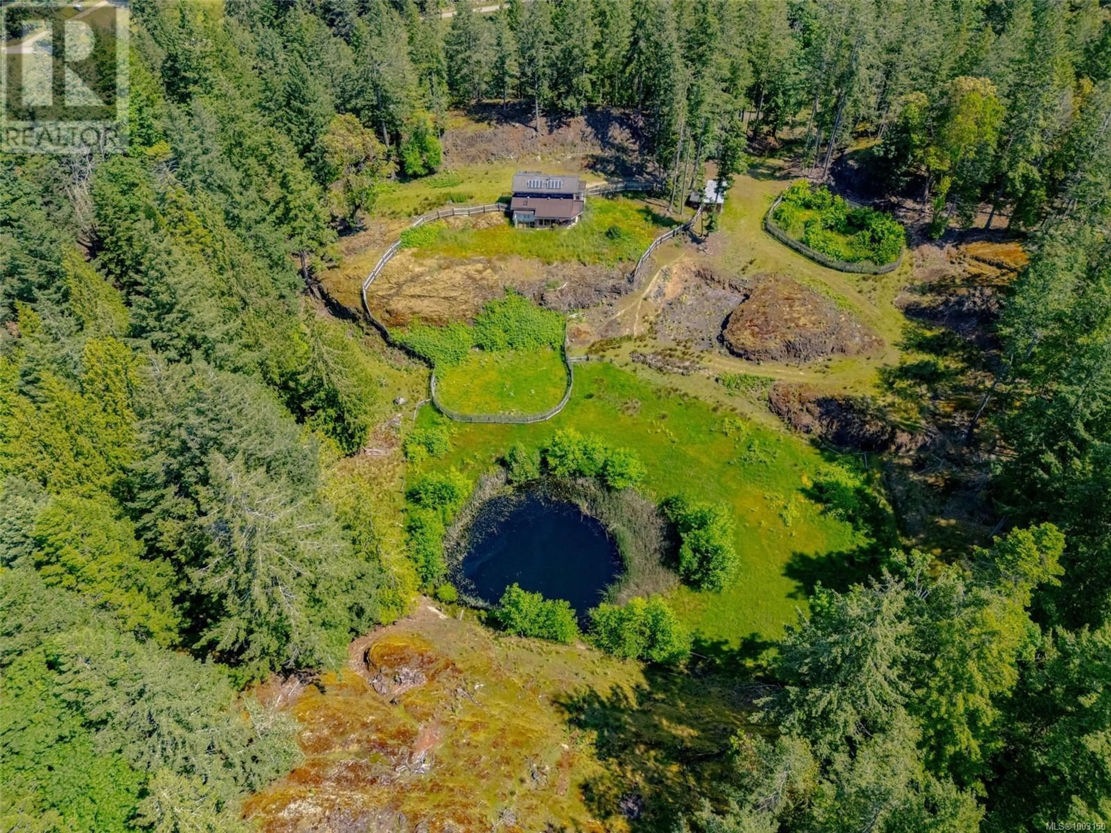 A pic from outside/outdoor area/front of a property/back of a property/a pic from drone, forest/trees view for 9 MAIN ROAD, Lasqueti Island British Columbia V0R2J0