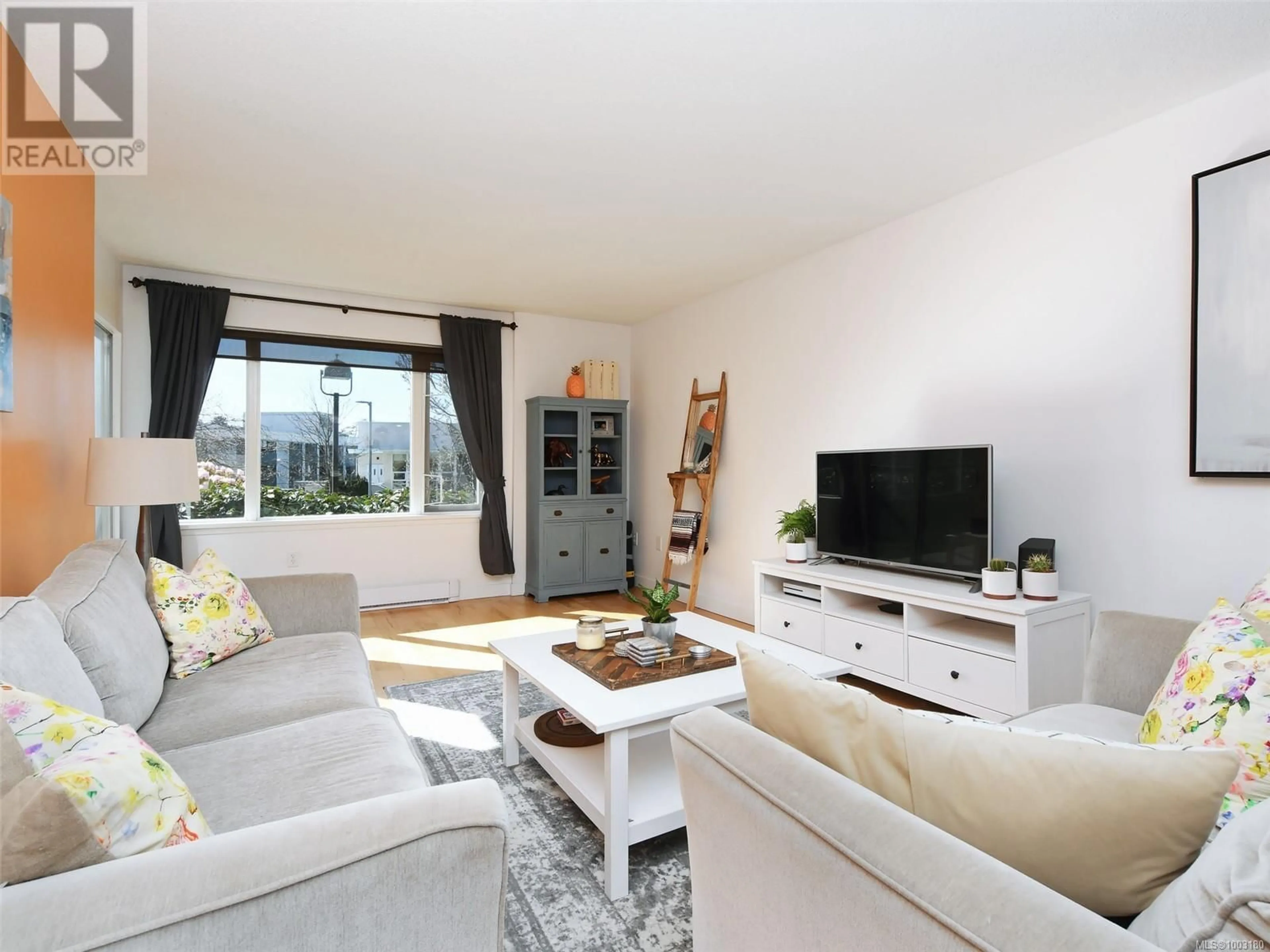 Living room with furniture, wood/laminate floor for 108 - 103 GORGE ROAD EAST, Victoria British Columbia V9Z6Z2