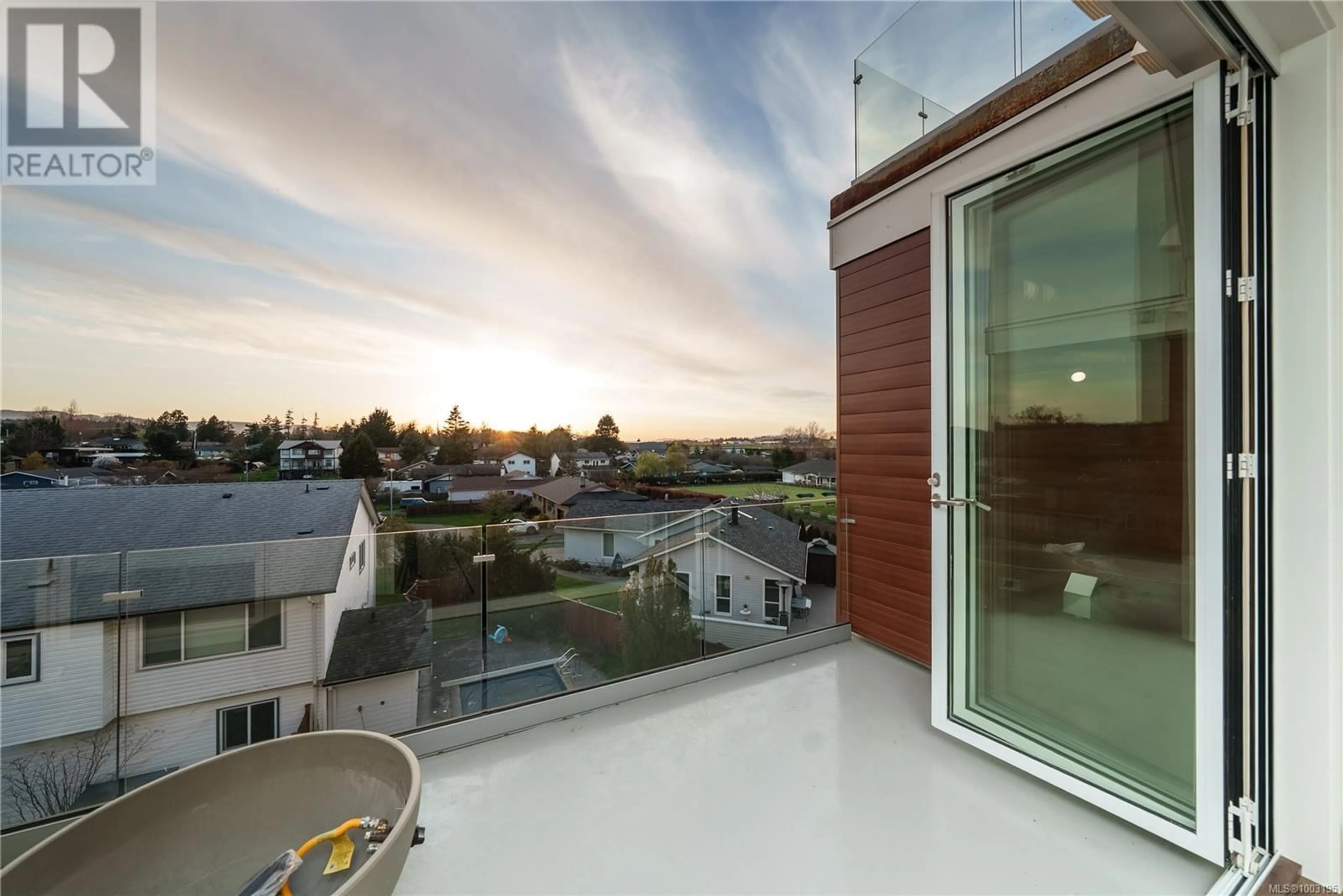 Balcony in the apartment, city buildings view from balcony for 207 - 9570 FIFTH STREET, Sidney British Columbia V8L2W5