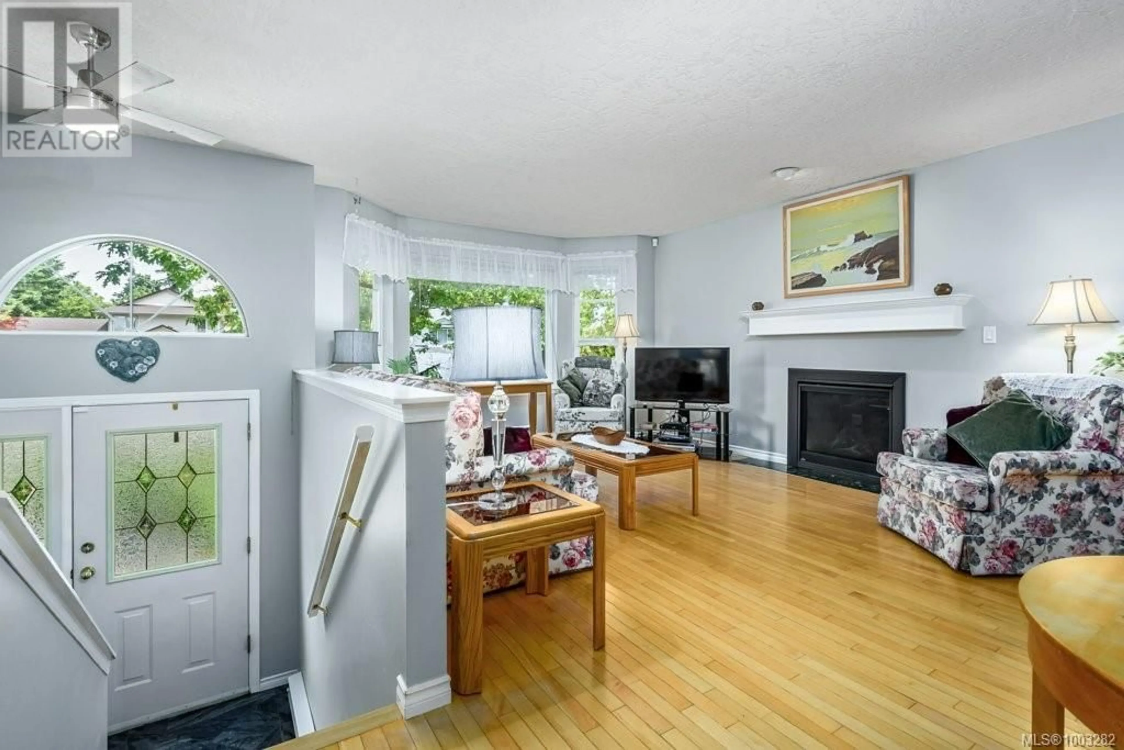 Living room with furniture, wood/laminate floor for 2267 NITNAT PLACE, Courtenay British Columbia V9N9E4