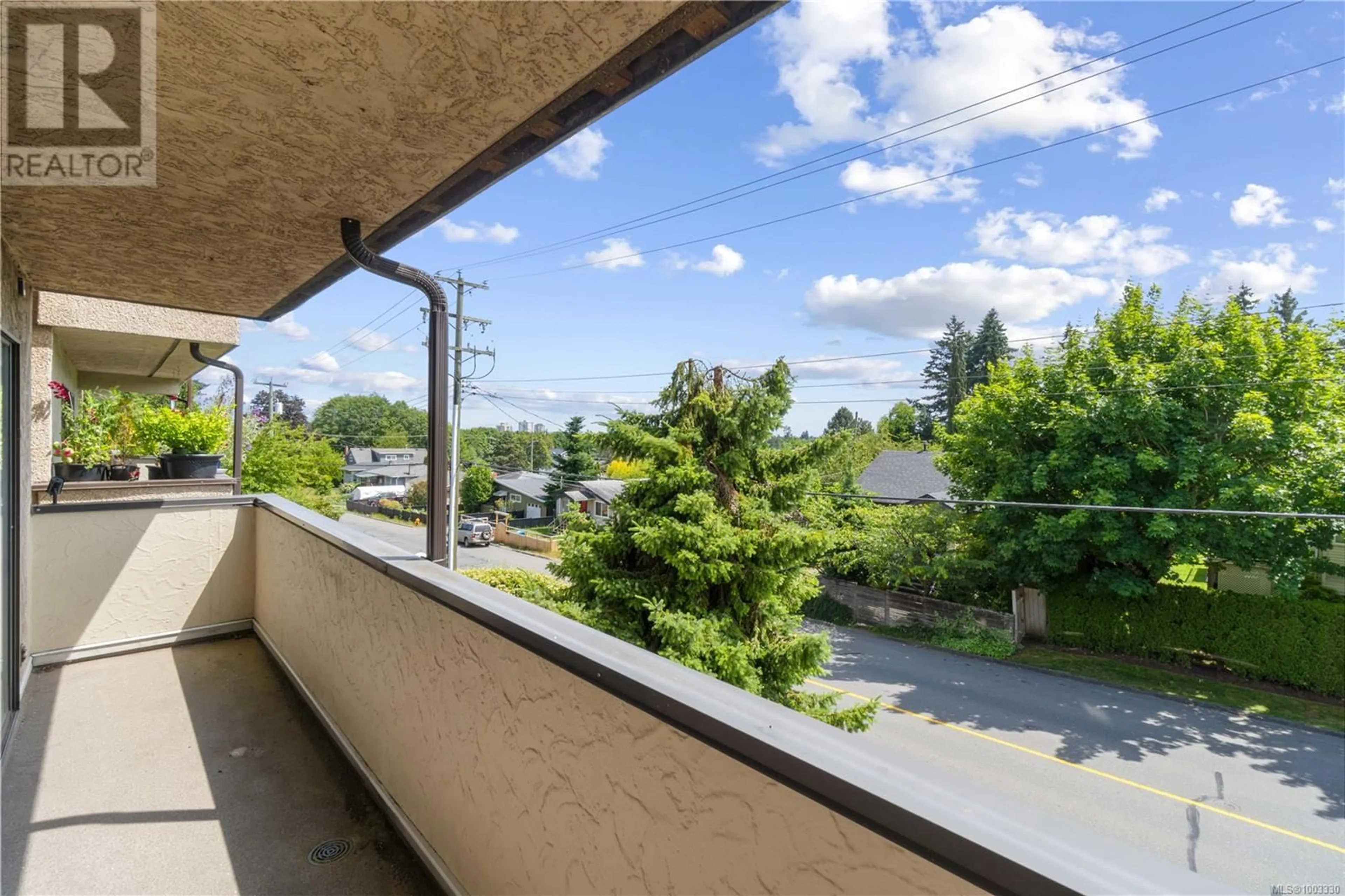 Patio, city buildings view from balcony for 203 - 550 BRADLEY STREET, Nanaimo British Columbia V9S1C1