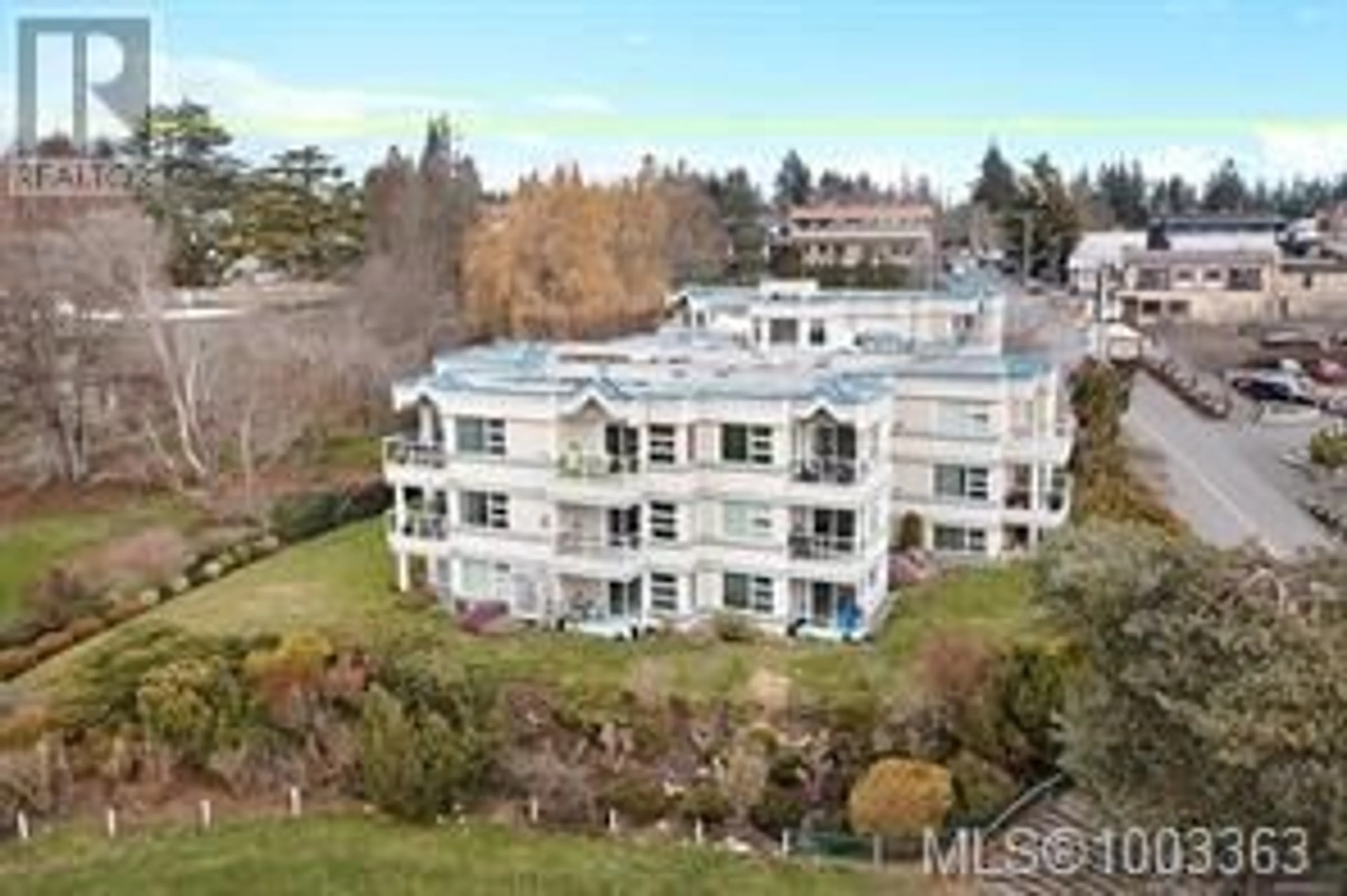 A pic from outside/outdoor area/front of a property/back of a property/a pic from drone, water/lake/river/ocean view for 305 - 137 PORT AUGUSTA STREET, Comox British Columbia V9M3N8