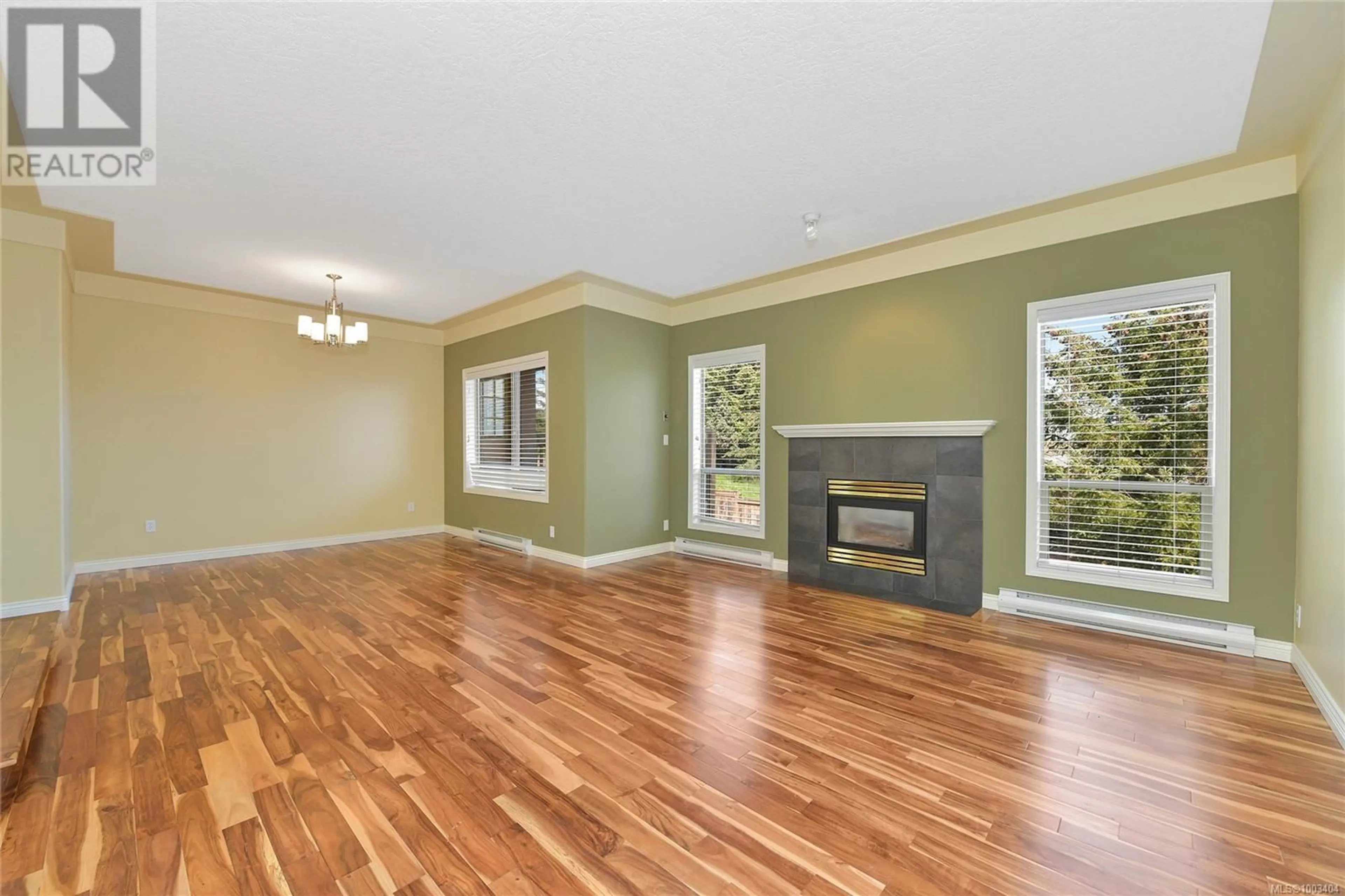 Living room with furniture, wood/laminate floor for 3980 HELEN ROAD, Saanich British Columbia V8Z5C5