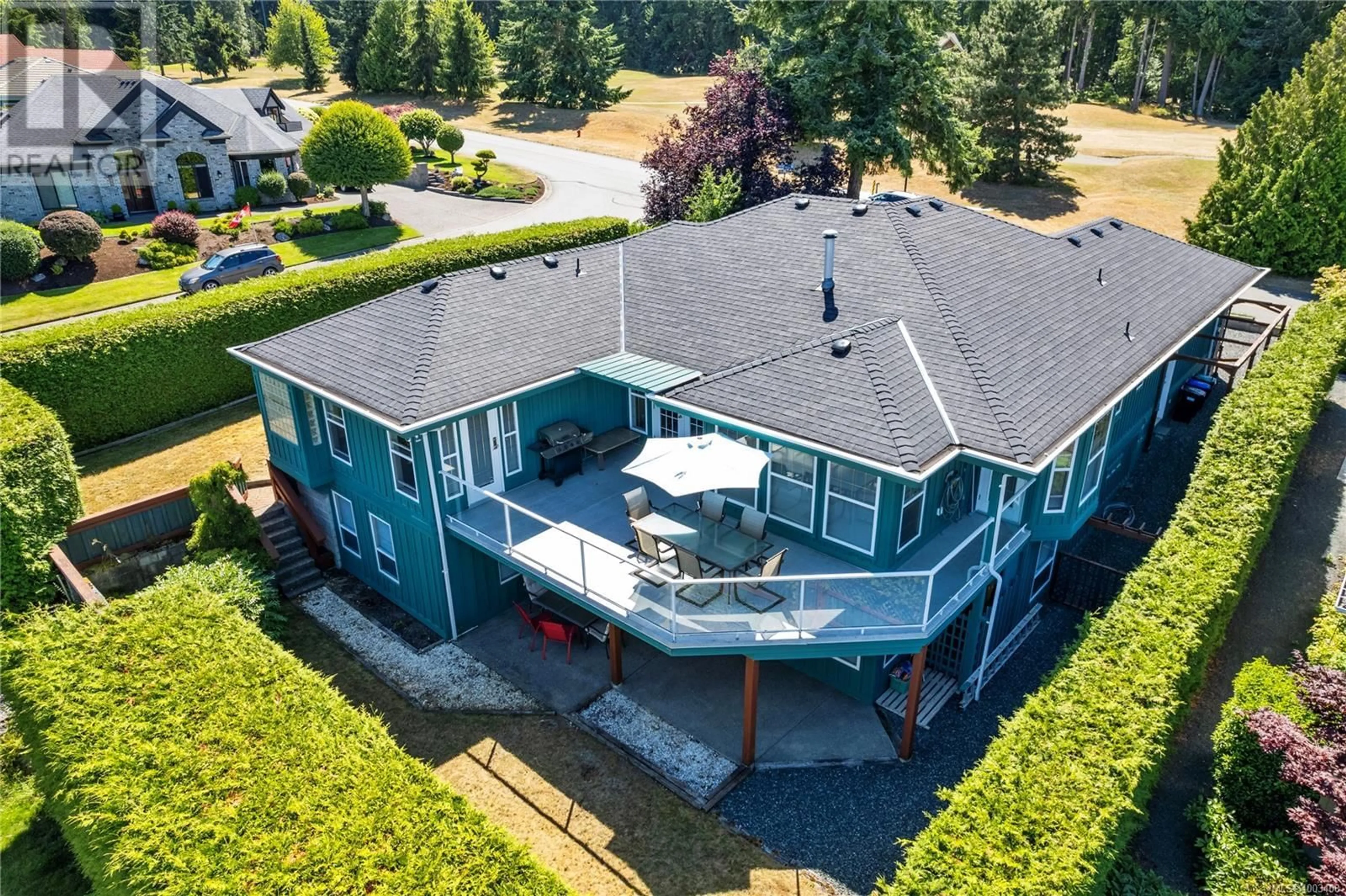 A pic from outside/outdoor area/front of a property/back of a property/a pic from drone, water/lake/river/ocean view for 514 COUNTRY CLUB DRIVE, Qualicum Beach British Columbia V9K2J9