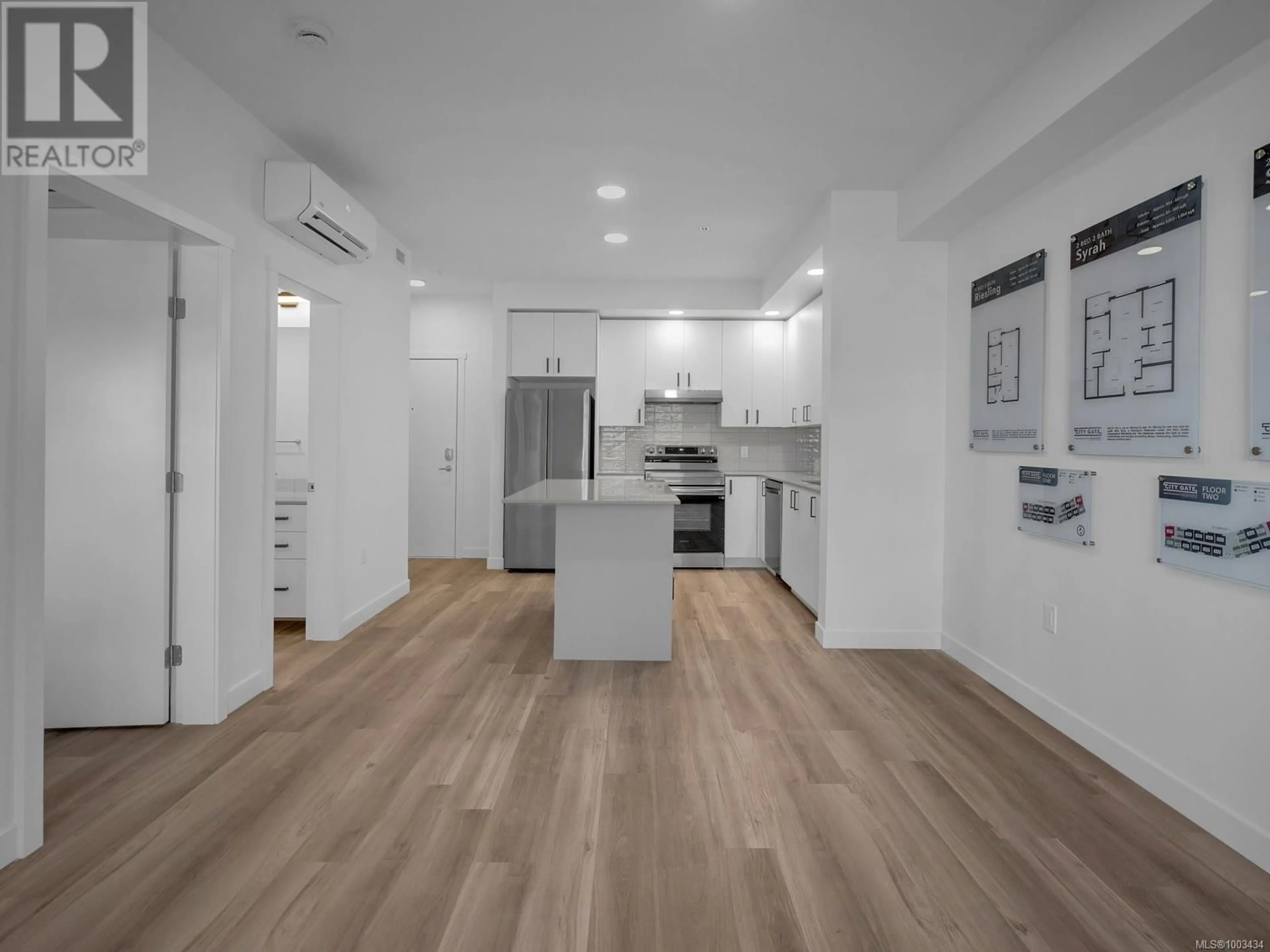 Open concept kitchen, wood/laminate floor for 116 - 2390 CITY GATE BOULEVARD, Langford British Columbia V9B7E8