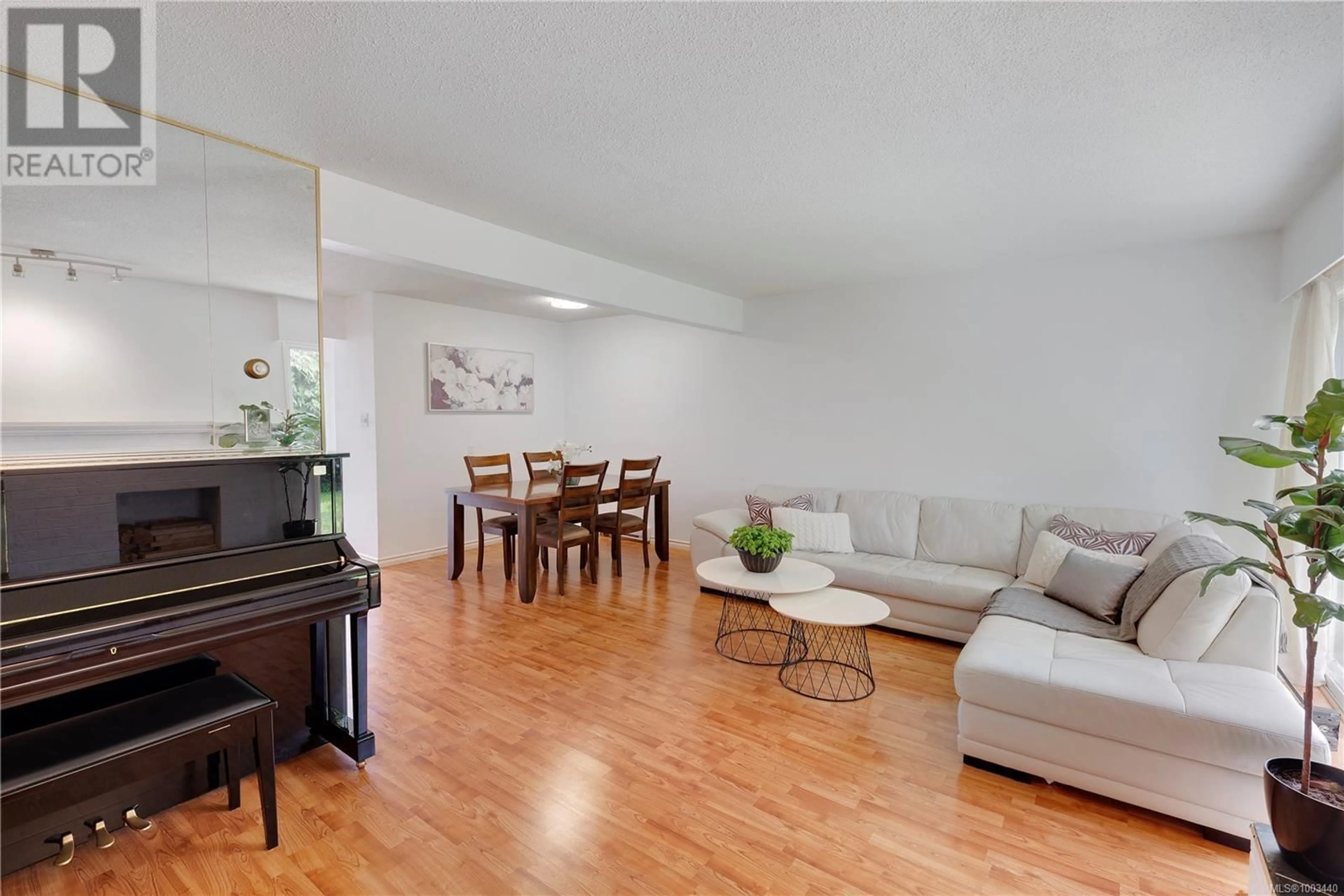 Living room with furniture, wood/laminate floor for 48 - 3987 GORDON HEAD ROAD, Saanich British Columbia V8N3X5