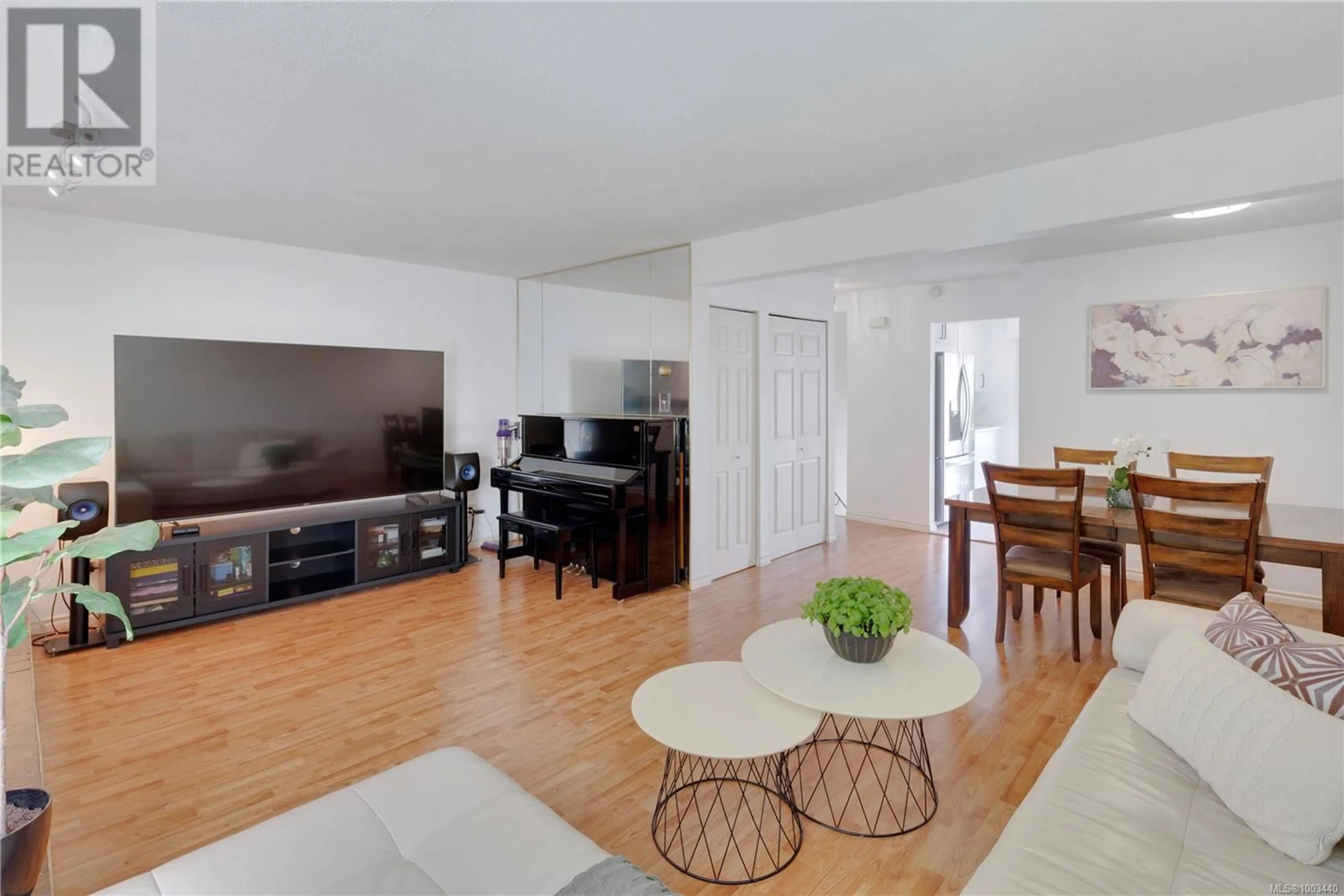 Living room with furniture, wood/laminate floor for 48 - 3987 GORDON HEAD ROAD, Saanich British Columbia V8N3X5