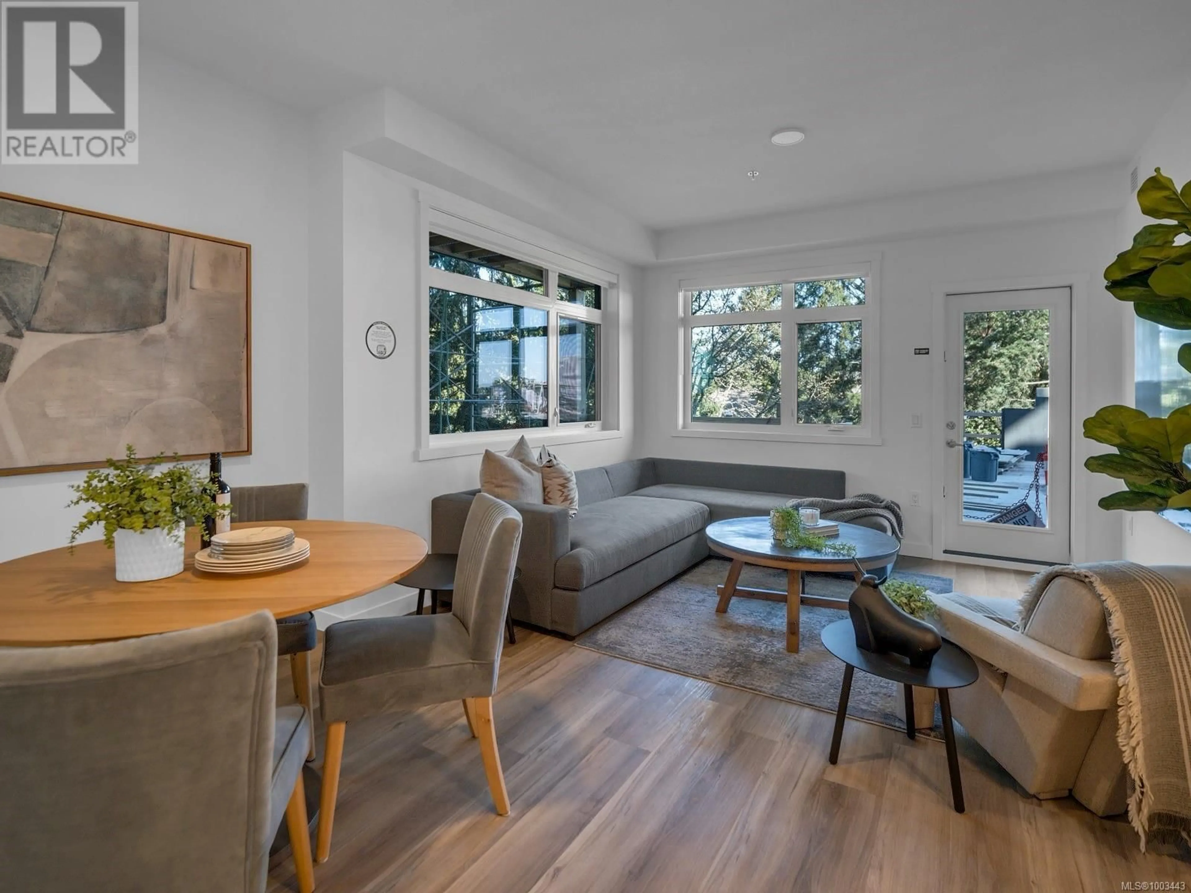 Living room with furniture, wood/laminate floor for 319 - 2390 CITY GATE BOULEVARD, Langford British Columbia V9B7E8