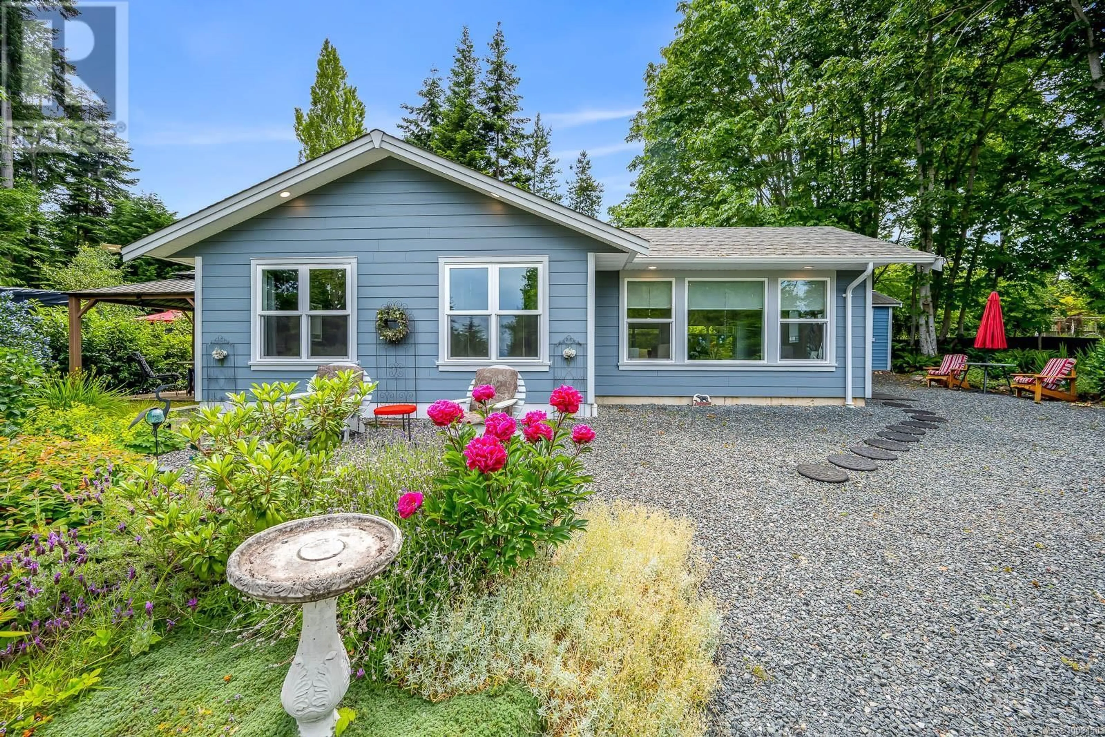 Home with vinyl exterior material, street for 4550 MAPLE GUARD DRIVE, Bowser British Columbia V0R1G0
