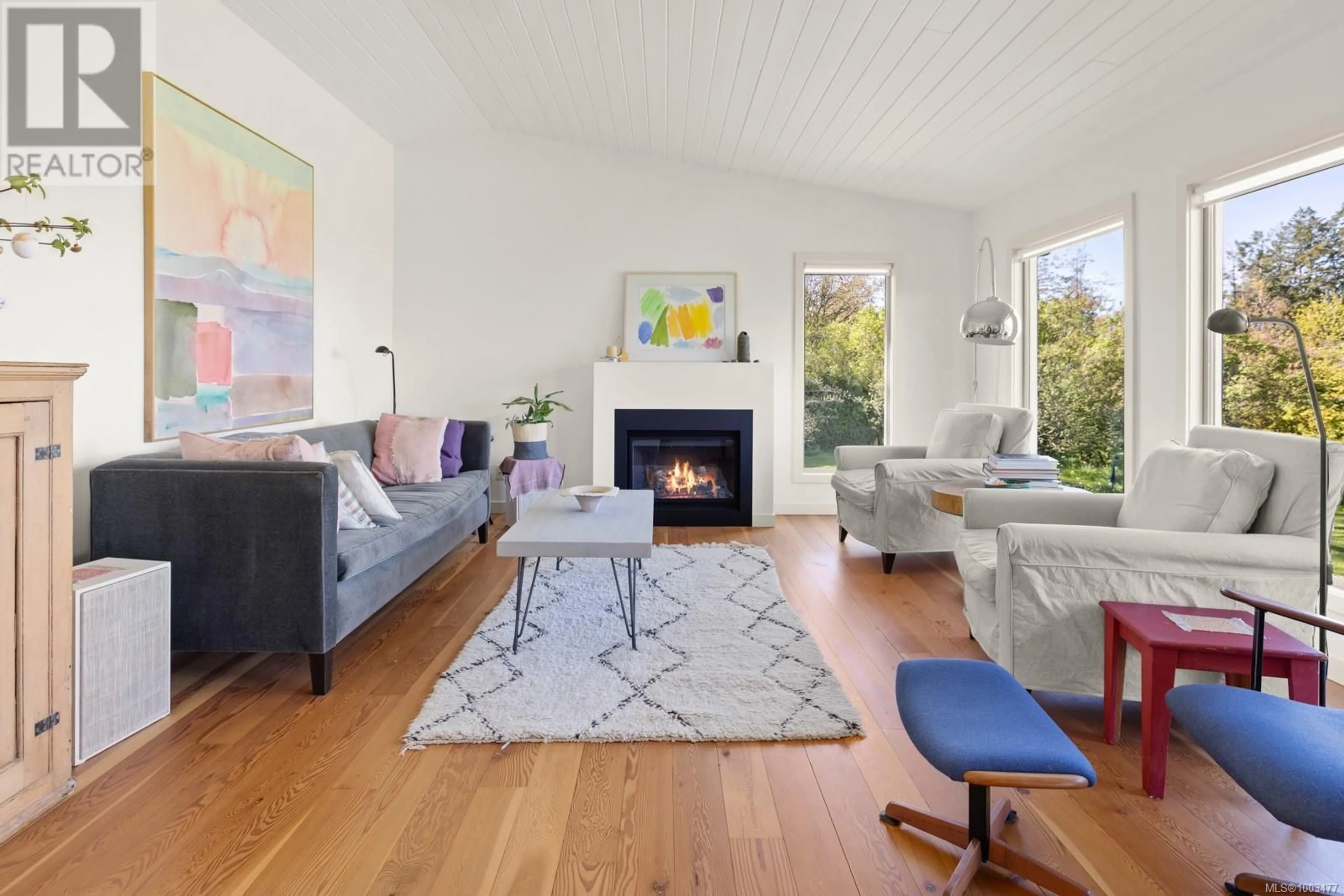 Living room with furniture, wood/laminate floor for 9710 GLENELG AVENUE, North Saanich British Columbia V8L5H4