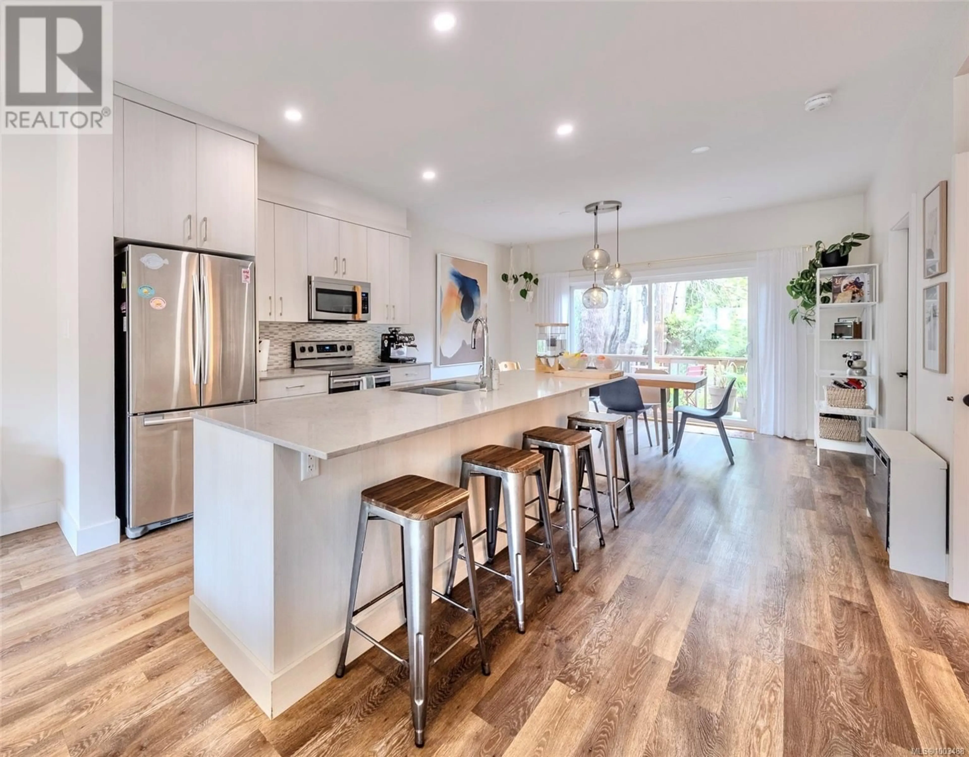 Open concept kitchen, wood/laminate floor for 14 - 625 HELLESEN DRIVE, Tofino British Columbia V0R2Z0