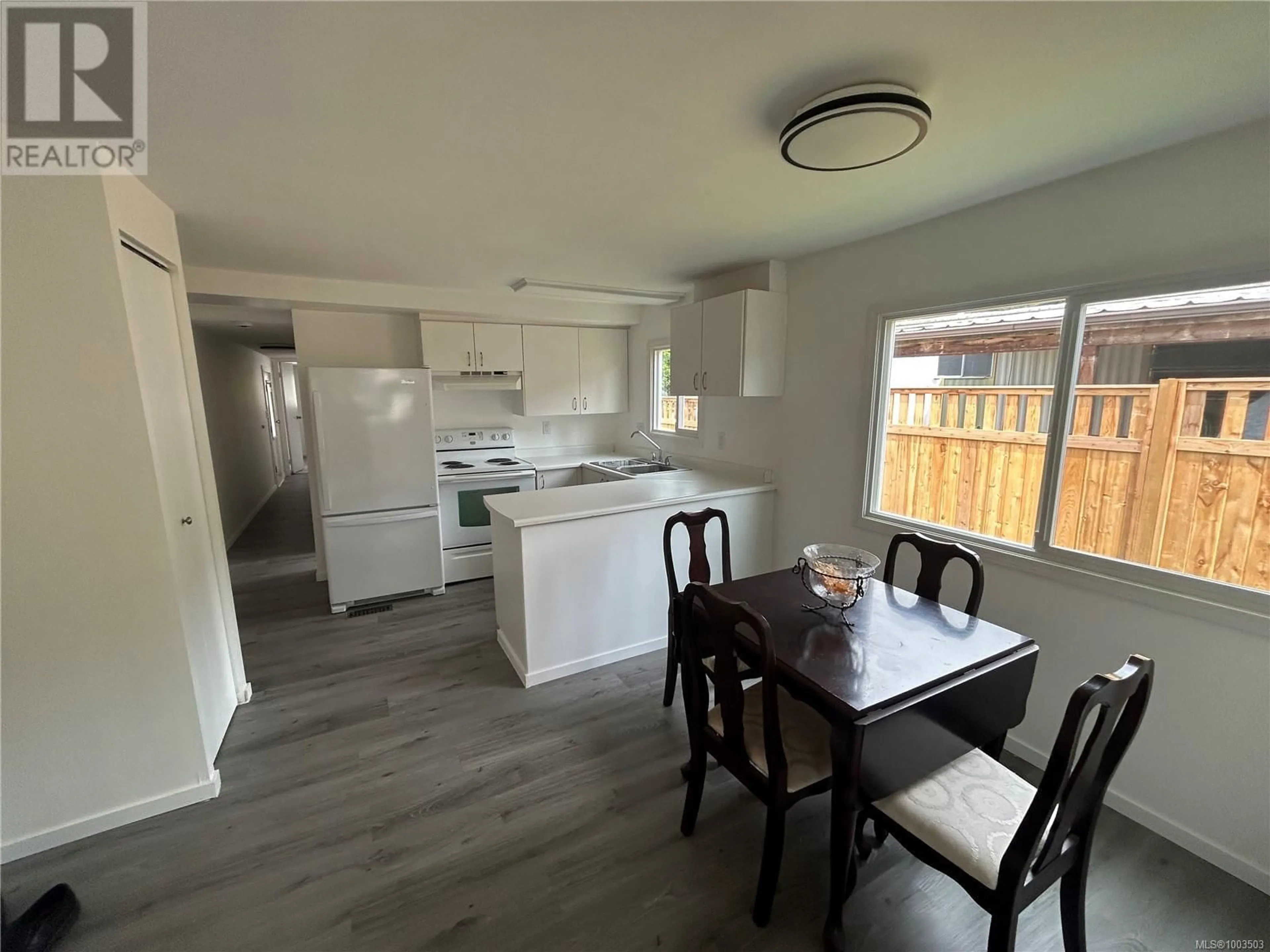 Open concept kitchen, wood/laminate floor for 41 - 2807 SOOKE LAKE ROAD, Langford British Columbia V9B4P9