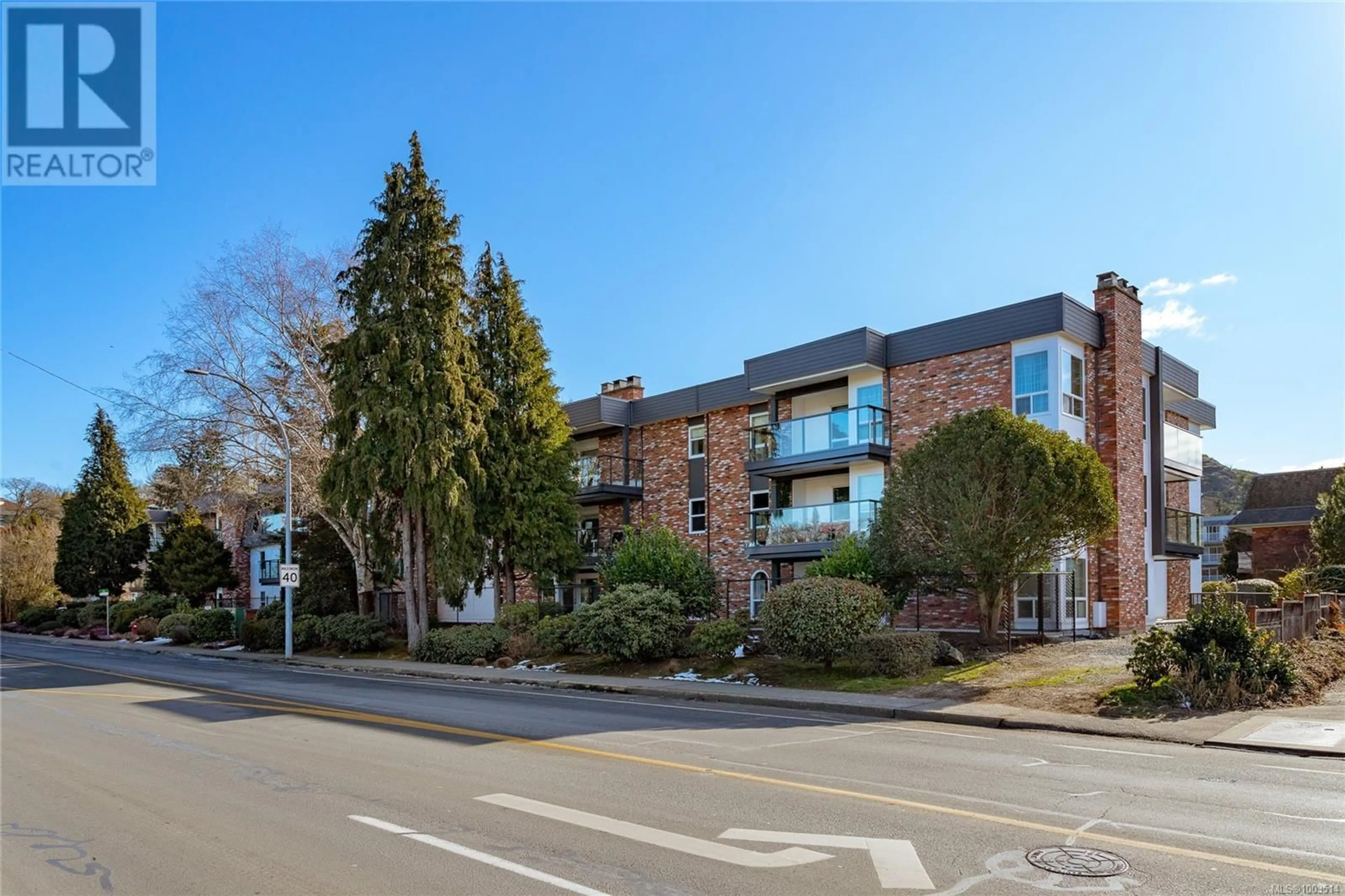 A pic from outside/outdoor area/front of a property/back of a property/a pic from drone, street for 203 - 1725 CEDAR HILL CROSS ROAD EAST, Saanich British Columbia V8P2P8