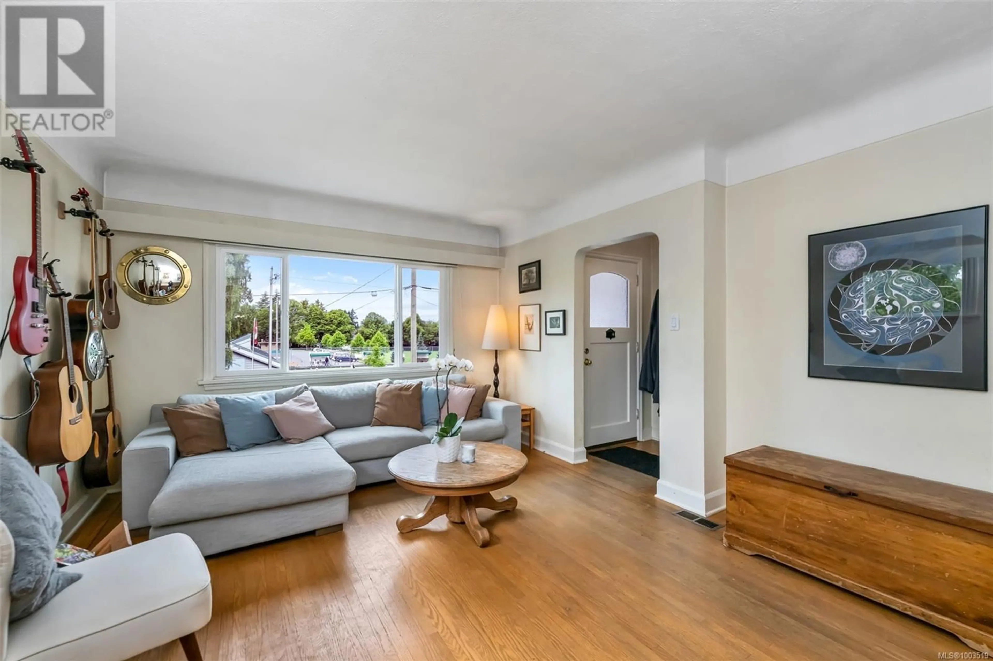 Living room with furniture, wood/laminate floor for 3929 LASALLE STREET, Saanich British Columbia V8P3L8