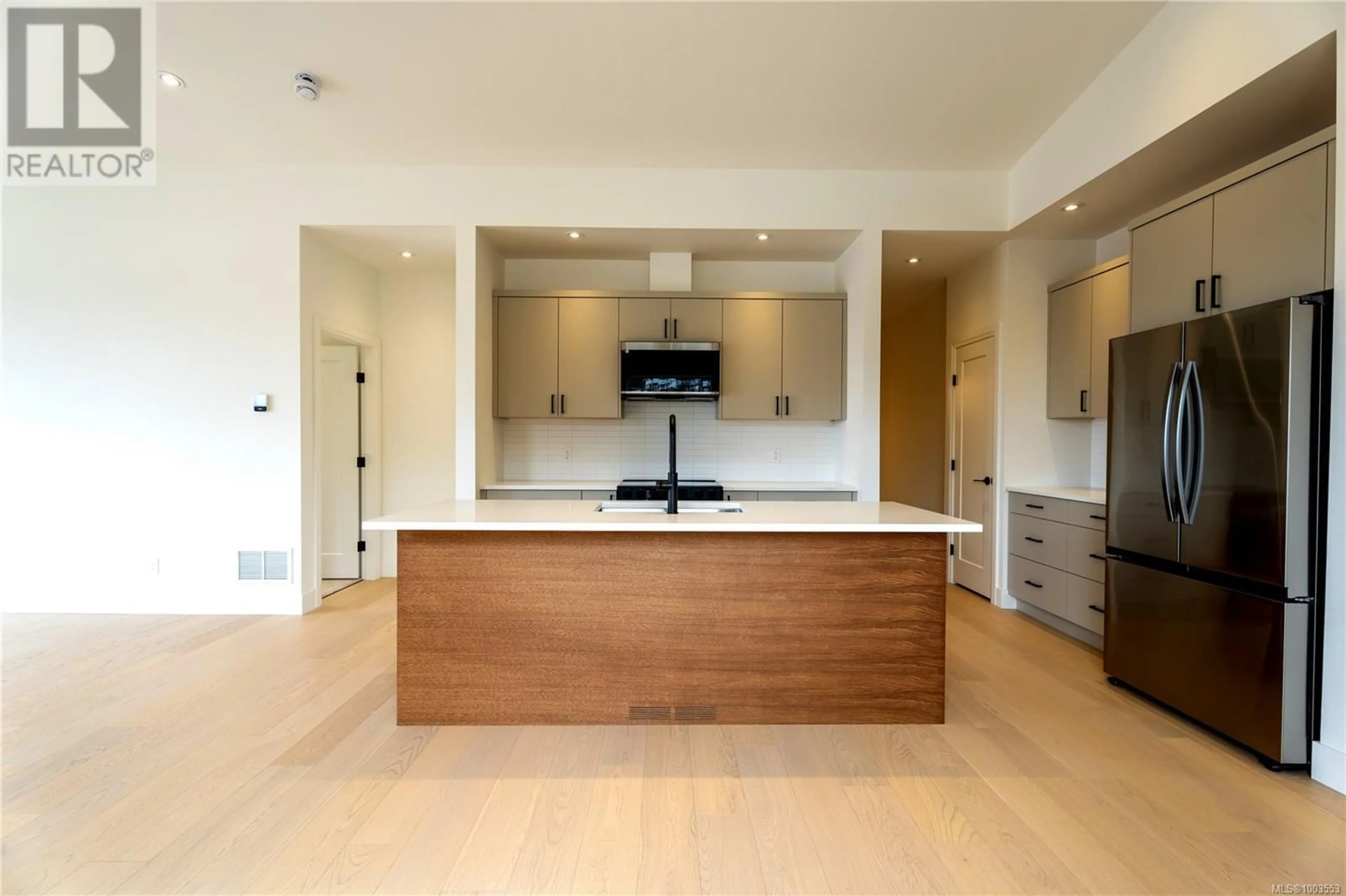 Open concept kitchen, wood/laminate floor for 117 - 3116 WOODRUSH DRIVE, Duncan British Columbia V9L0G1