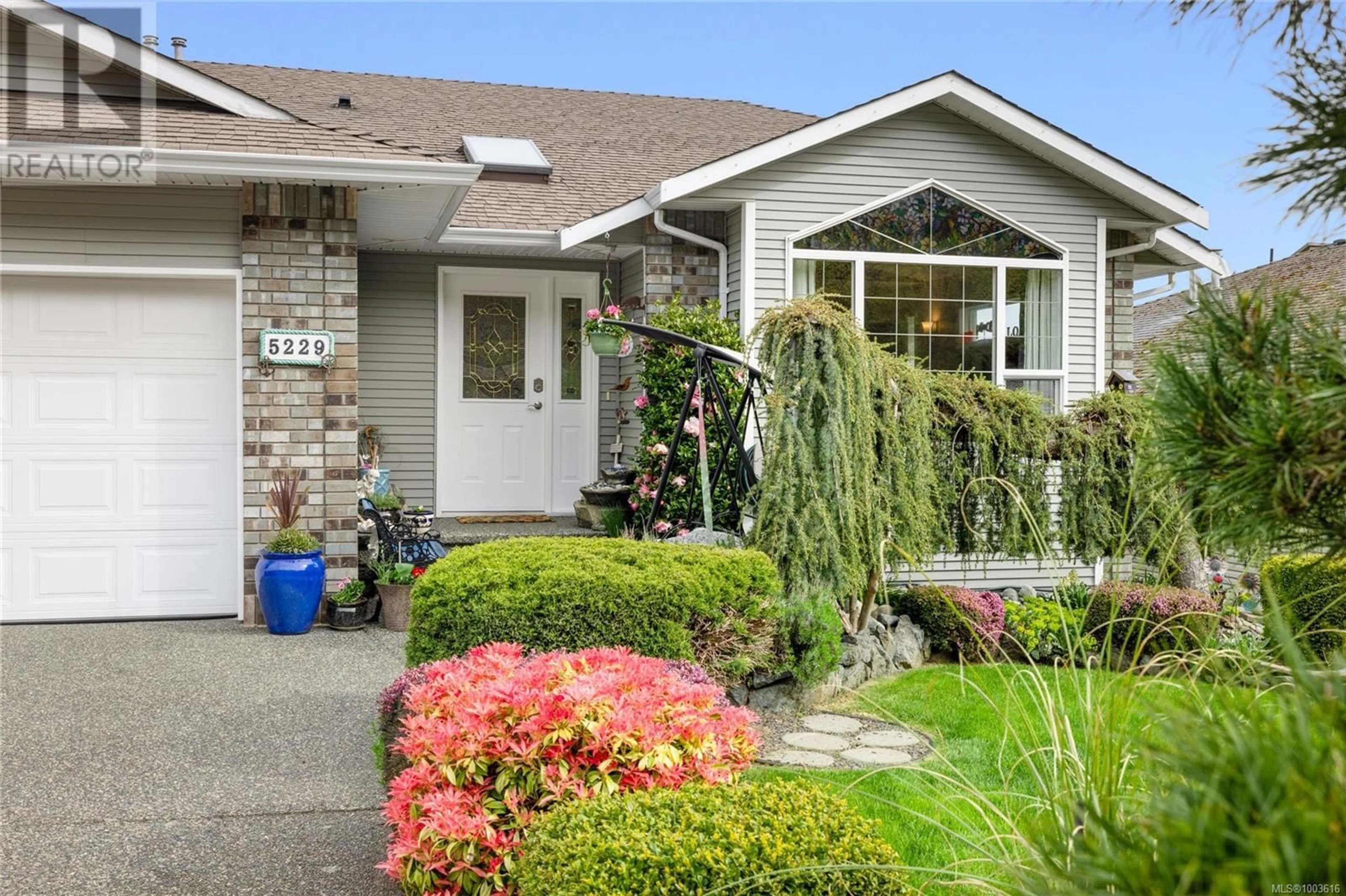 Home with vinyl exterior material, street for 5229 FOX PLACE, Nanaimo British Columbia V9T6K6