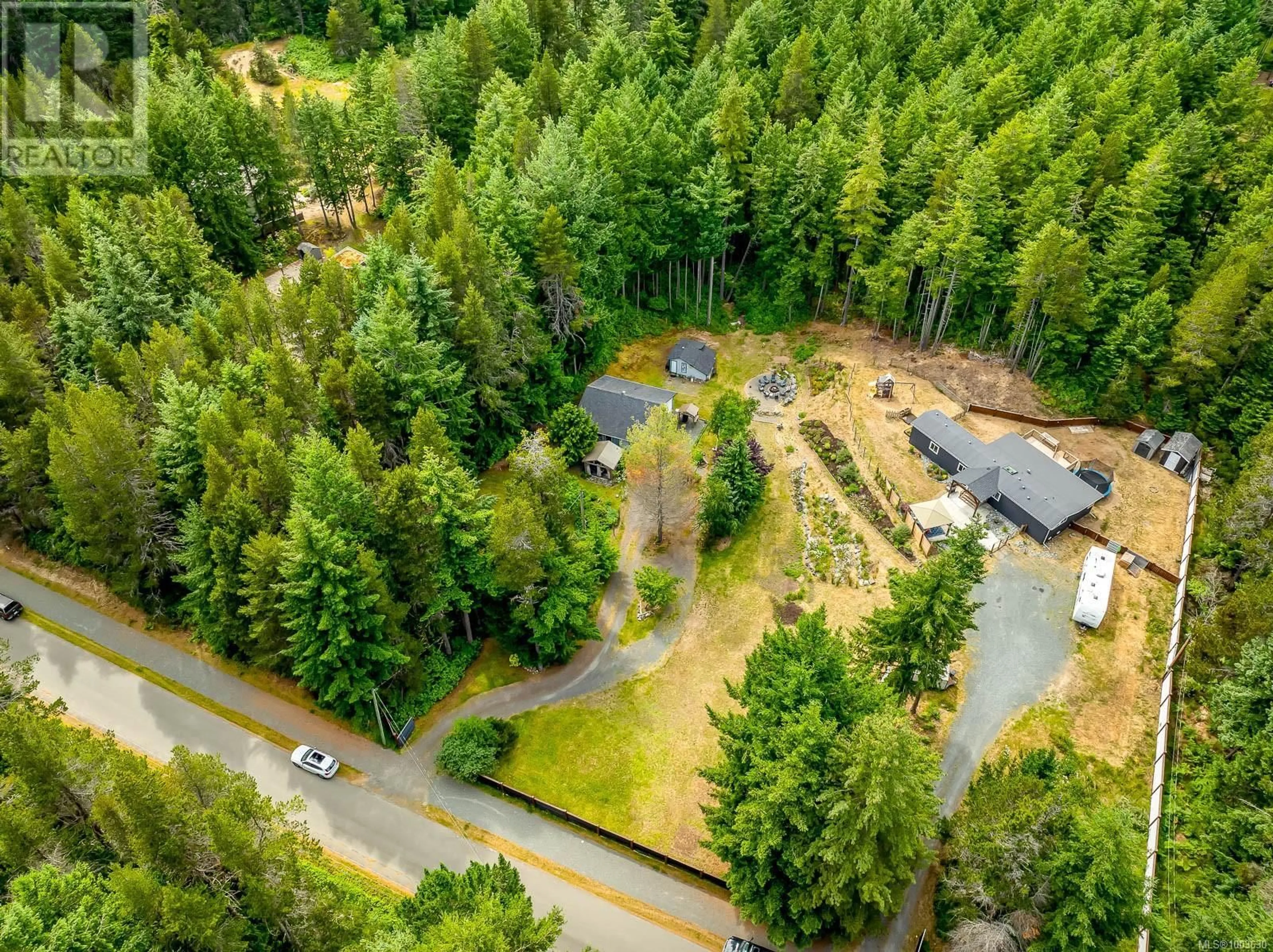 A pic from outside/outdoor area/front of a property/back of a property/a pic from drone, forest/trees view for 677, 693 BRENT ROAD, Comox British Columbia V9M3V9