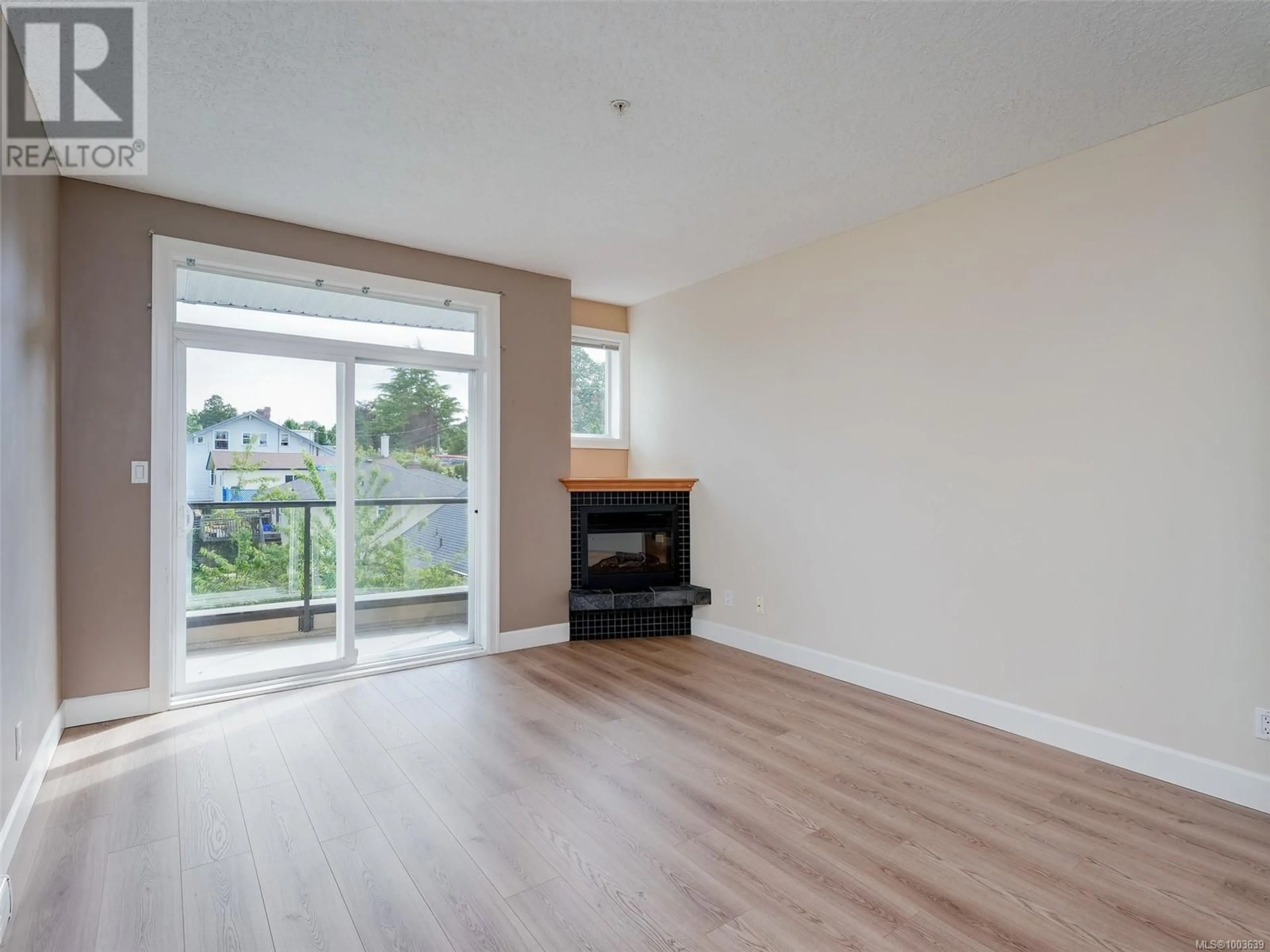 Living room with furniture, wood/laminate floor for 303 - 76 GORGE ROAD WEST, Saanich British Columbia V9A1M1