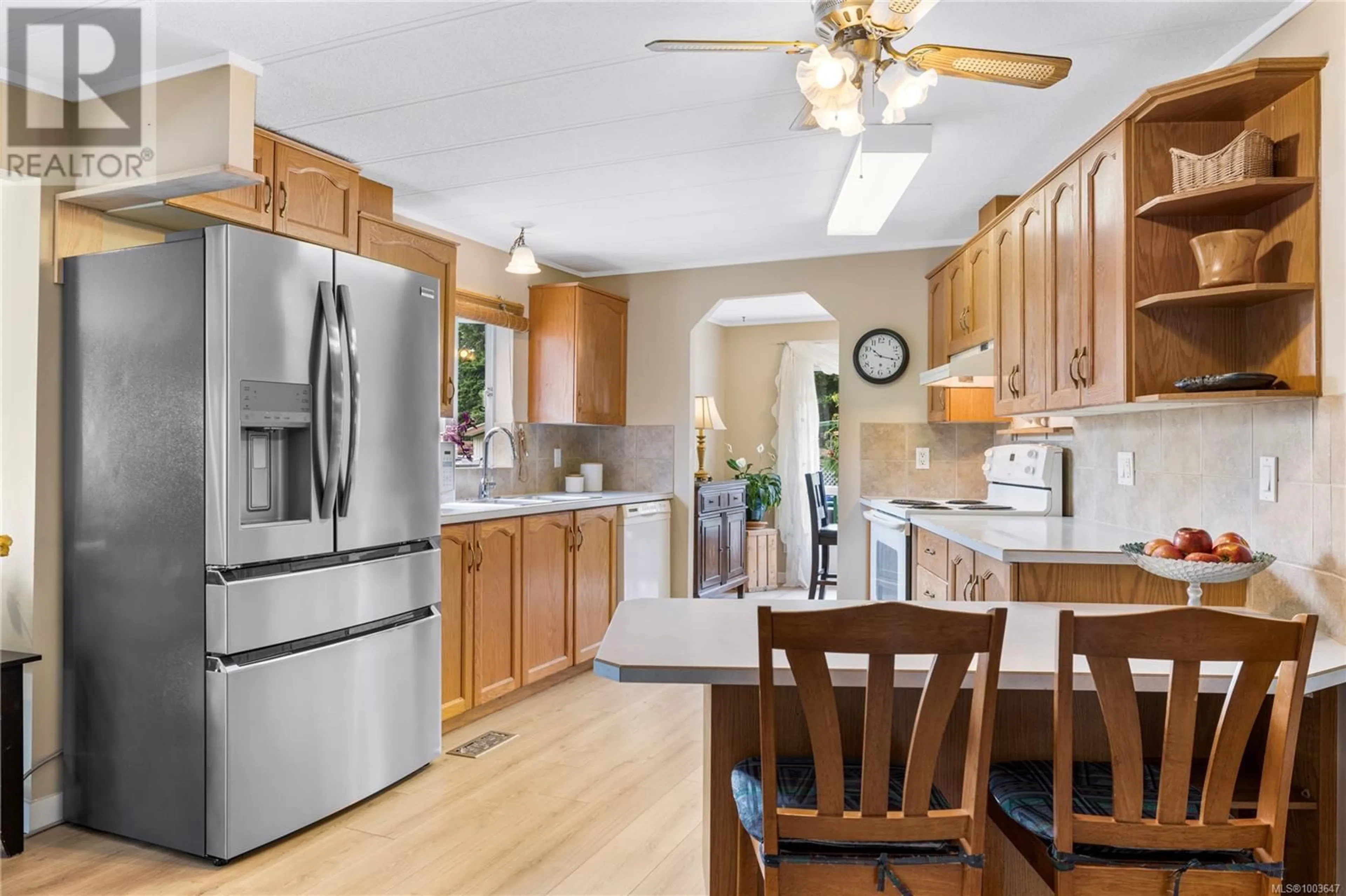Open concept kitchen, wood/laminate floor for 263 - 2465 APOLLO DRIVE, Nanoose Bay British Columbia V9P9K2