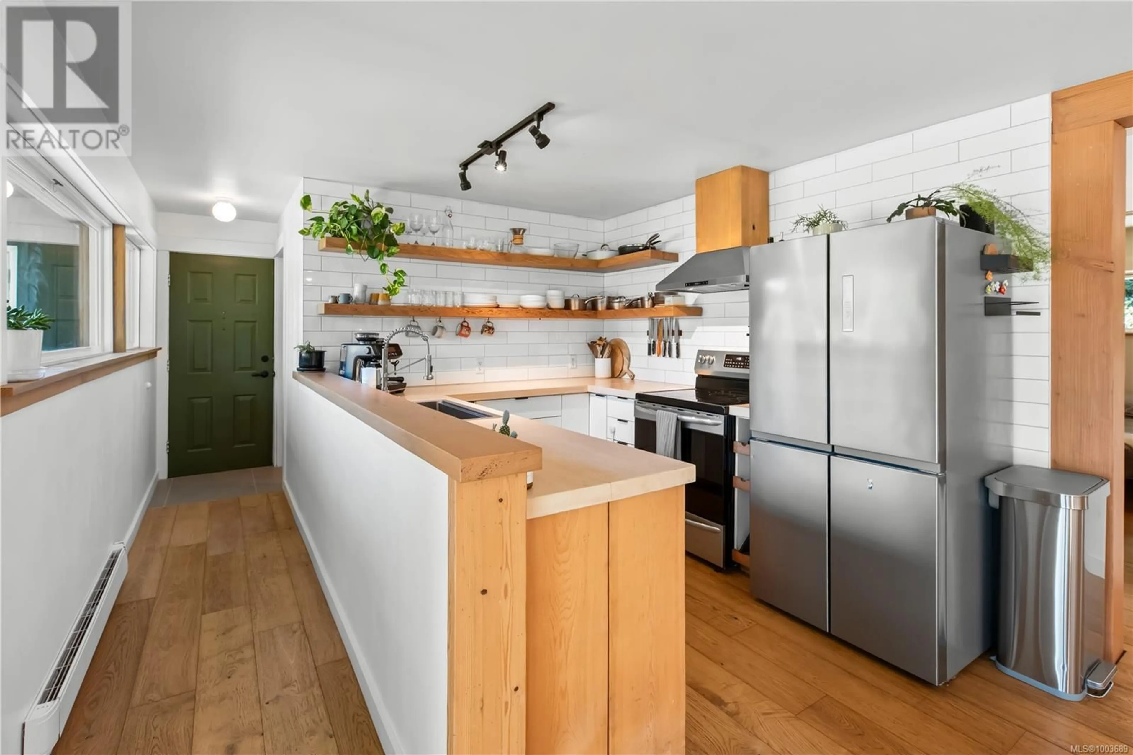 Open concept kitchen, wood/laminate floor for 8397 FABER ROAD, Port Alberni British Columbia V9Y9B4