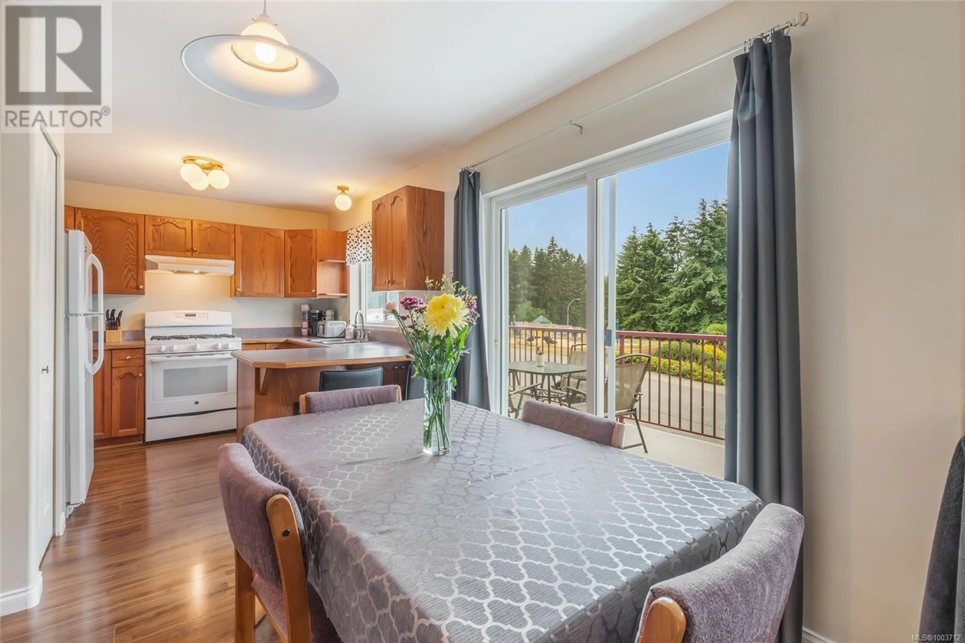 Open concept kitchen, wood/laminate floor for 5383 COLINWOOD DRIVE, Nanaimo British Columbia V9T6G2