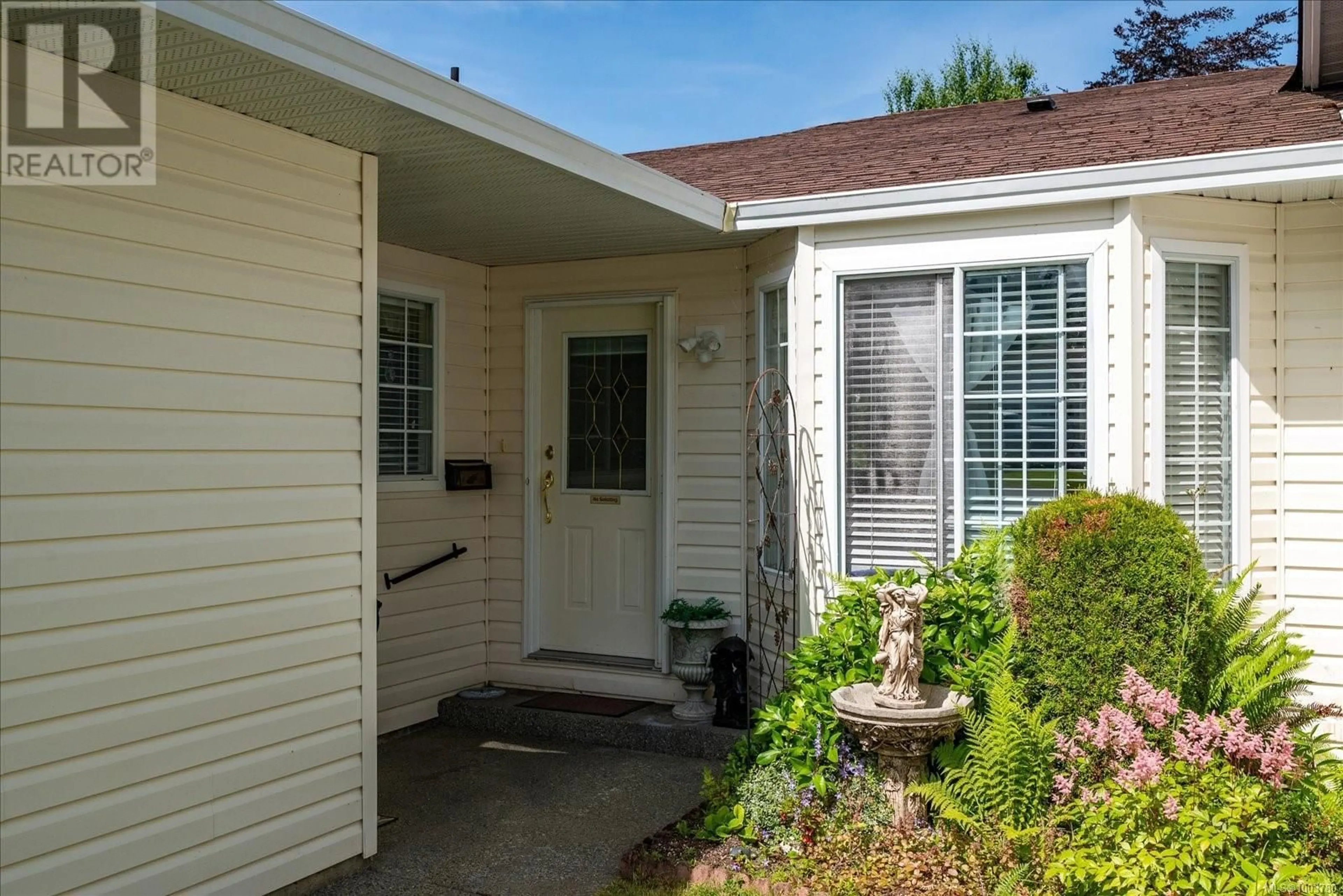 Home with vinyl exterior material, street for 8 - 2465 ORIOLE DRIVE, Nanaimo British Columbia V9T3P2