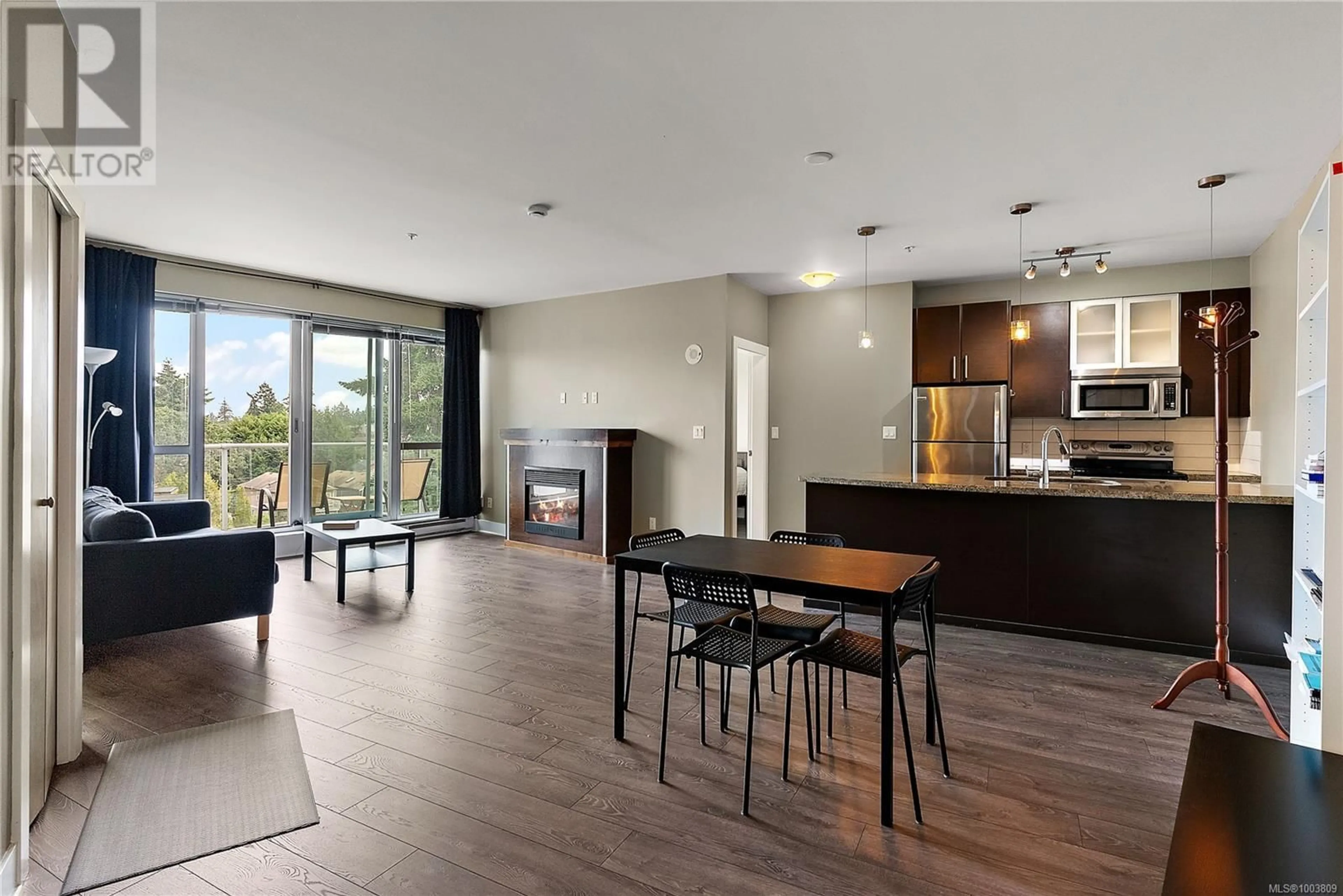 Open concept kitchen, wood/laminate floor for 509 - 2745 VETERANS MEMORIAL PARKWAY, Langford British Columbia V9B0H4
