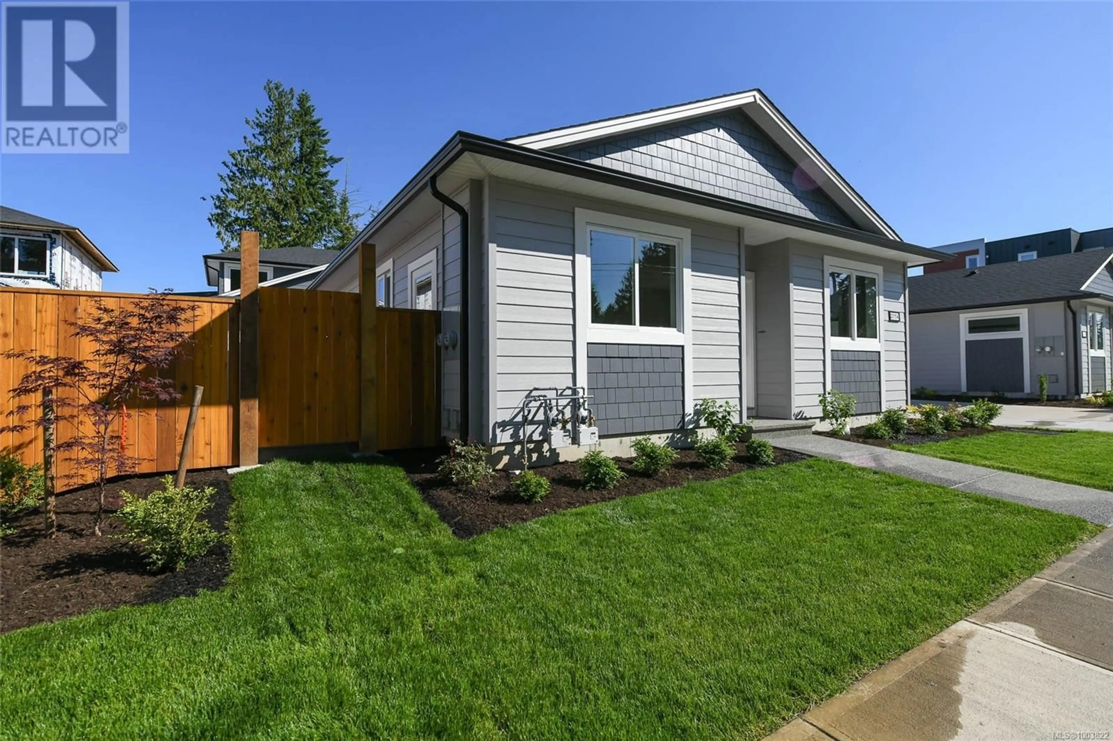 Home with vinyl exterior material, street for A - 2315 MCDONALD ROAD, Comox British Columbia V9M0C8