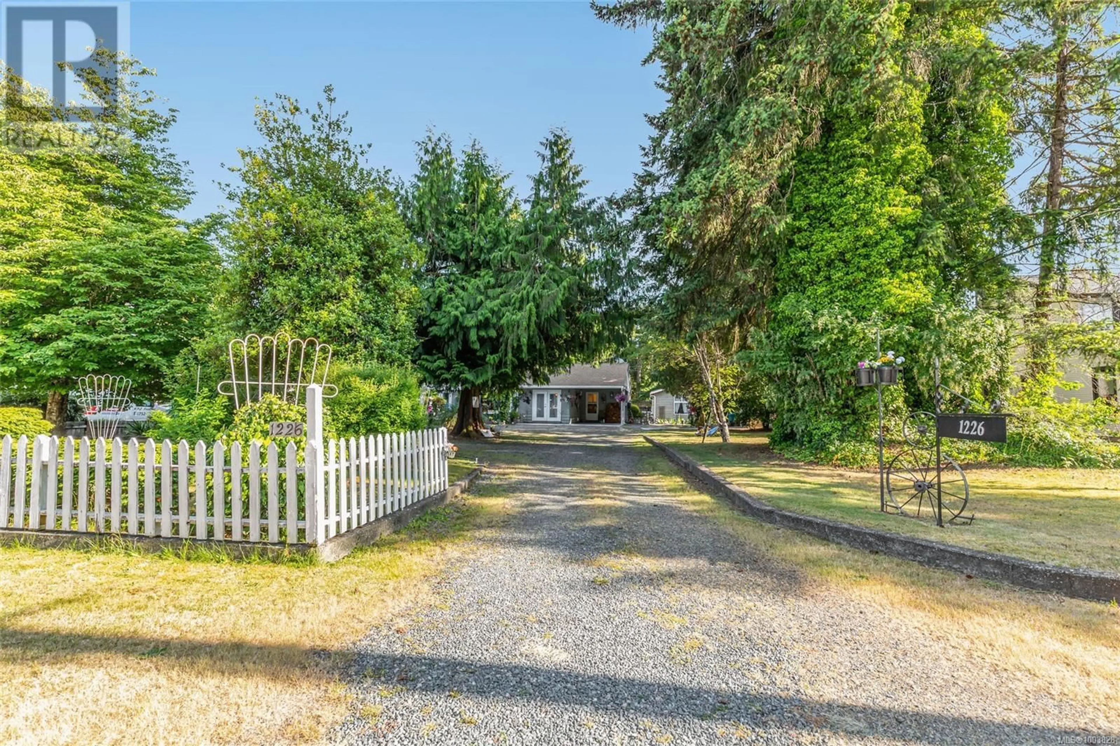A pic from outside/outdoor area/front of a property/back of a property/a pic from drone, street for 1226 CENTRE ROAD, Qualicum Beach British Columbia V9K2G8