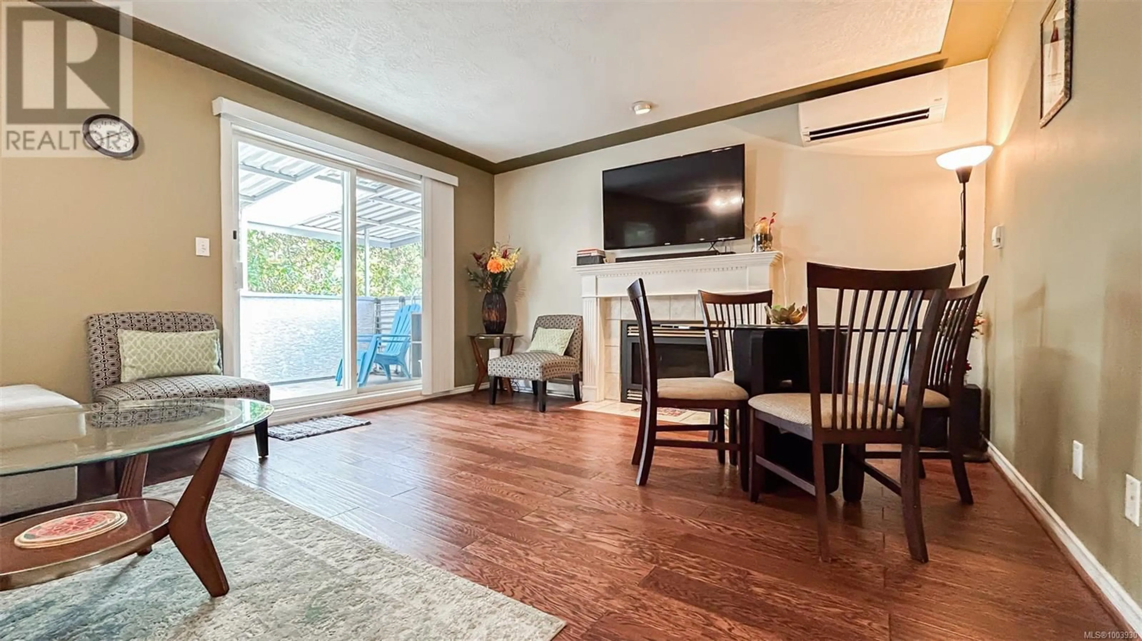 Living room with furniture, wood/laminate floor for 1988 MCTAVISH ROAD, North Saanich British Columbia V8L1C9