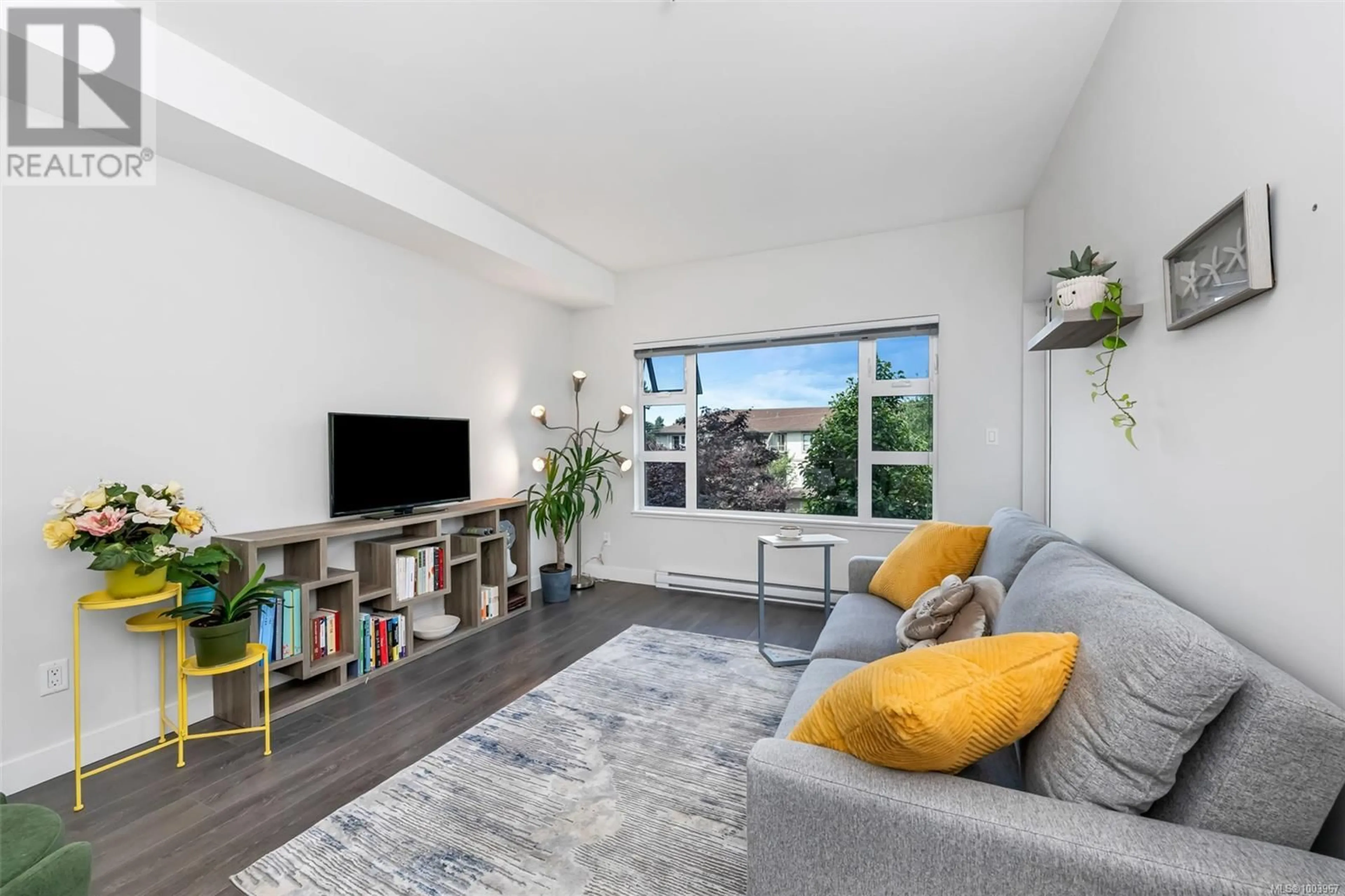 Living room with furniture, unknown for 201 - 3333 GLASGOW AVENUE, Saanich British Columbia V8X2S1