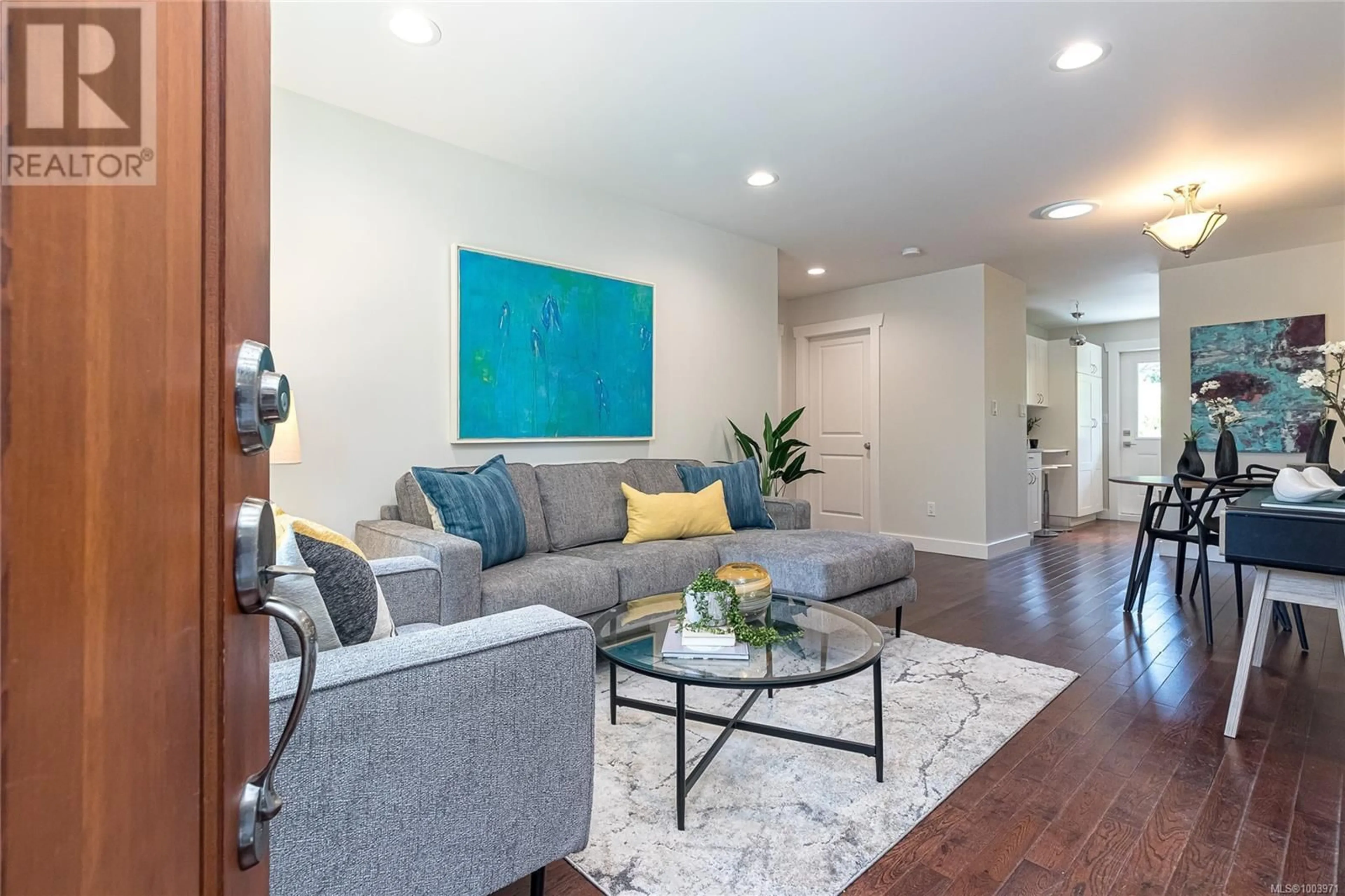 Living room with furniture, wood/laminate floor for 1955 RICHARDSON STREET, Victoria British Columbia V8S1S5