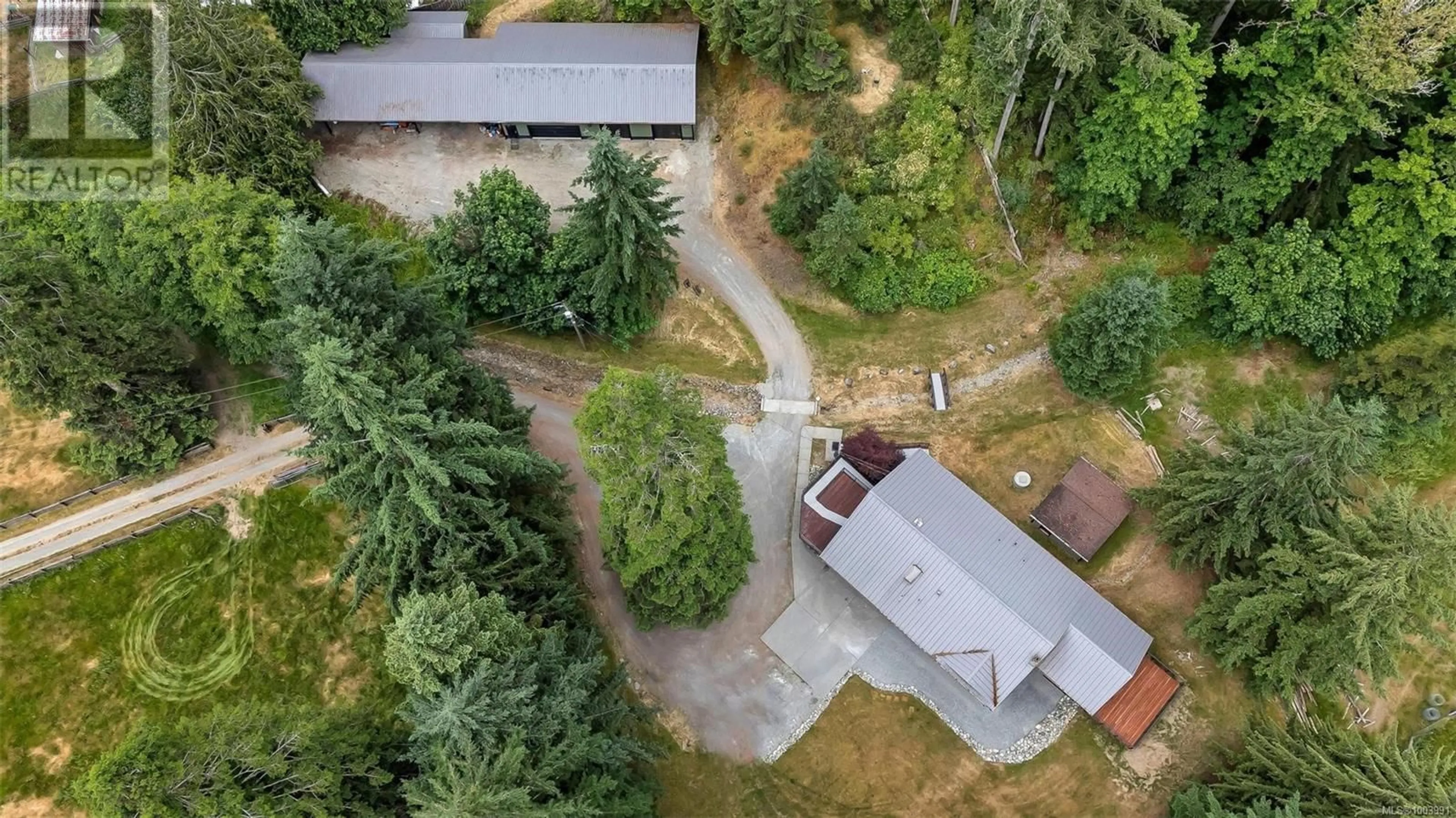 A pic from outside/outdoor area/front of a property/back of a property/a pic from drone, forest/trees view for 7518 ROSEVEAR ROAD, Duncan British Columbia V9L5Z8
