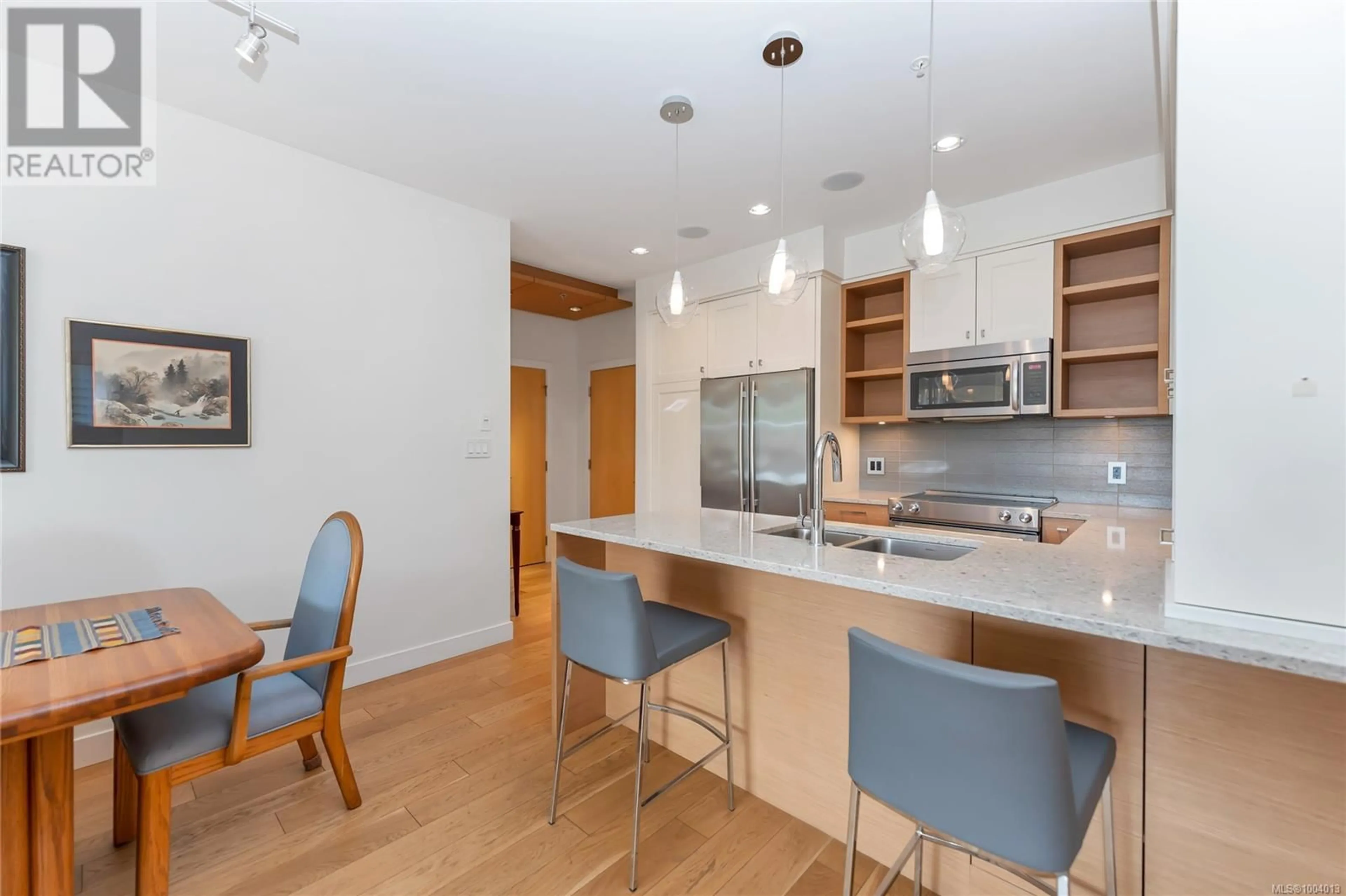 Open concept kitchen, wood/laminate floor for 206 - 1969 OAK BAY AVENUE, Victoria British Columbia V8R1E3