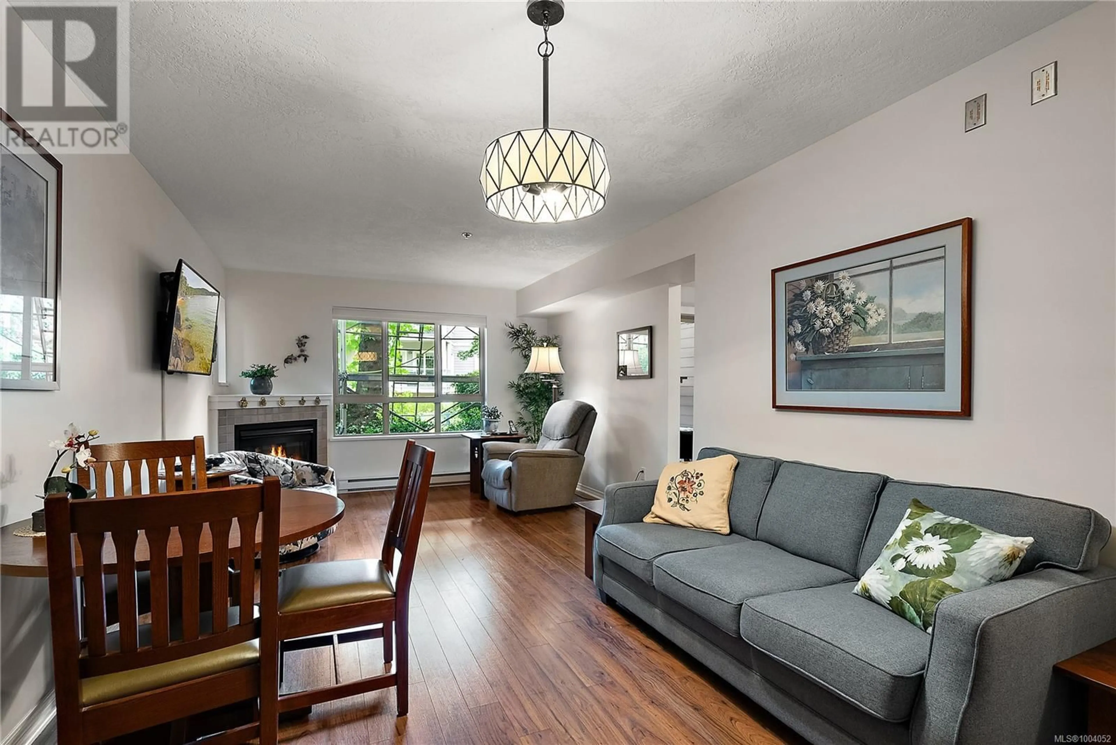 Living room with furniture, wood/laminate floor for 104 - 121 ALDERSMITH PLACE, View Royal British Columbia V9A7M7