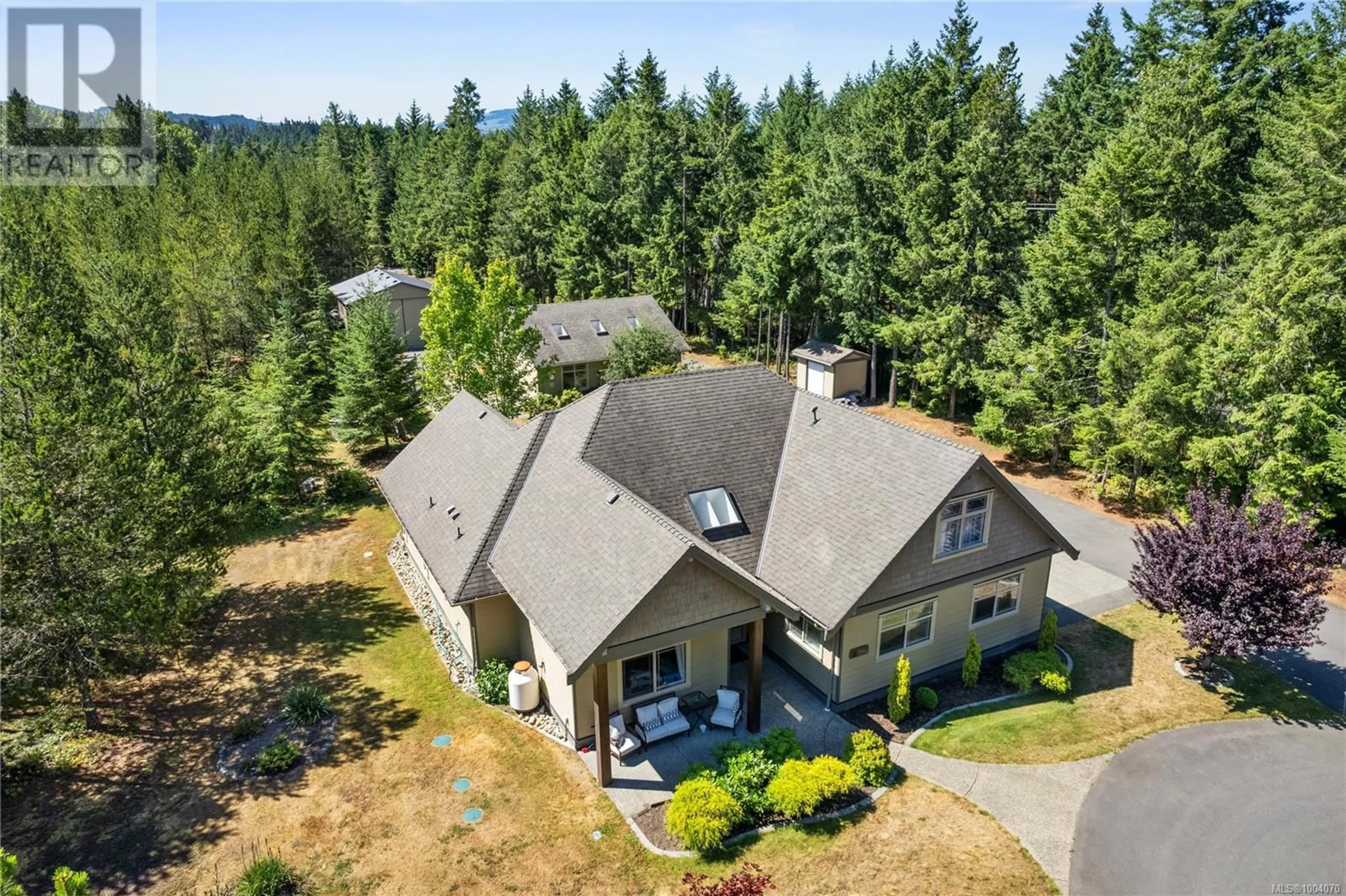 A pic from outside/outdoor area/front of a property/back of a property/a pic from drone, mountain view for 1050 PARADISE PLACE, Nanoose Bay British Columbia V9P9A4