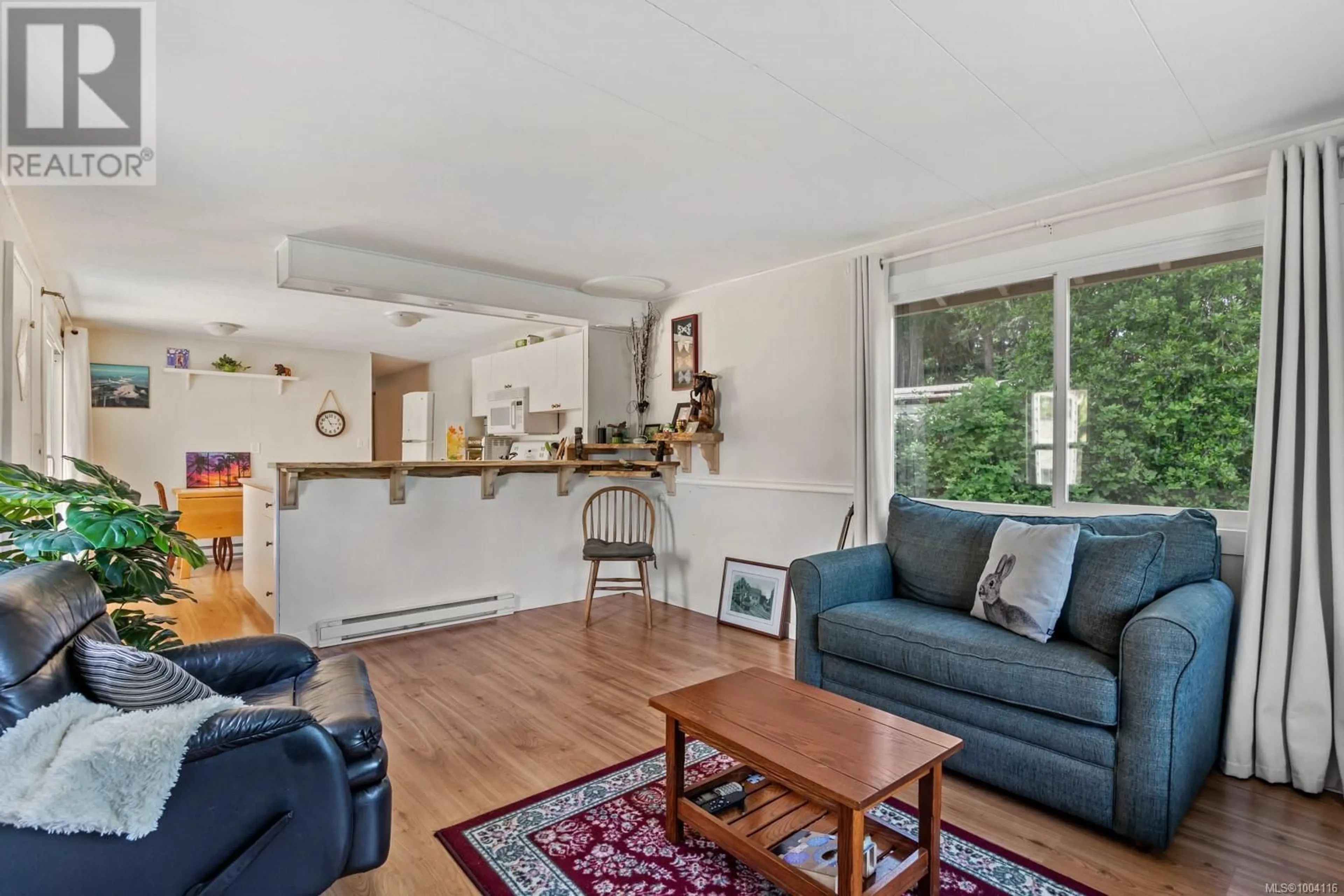 Living room with furniture, wood/laminate floor for 2059 AUSTIN ROAD, Comox British Columbia V9M3Z4