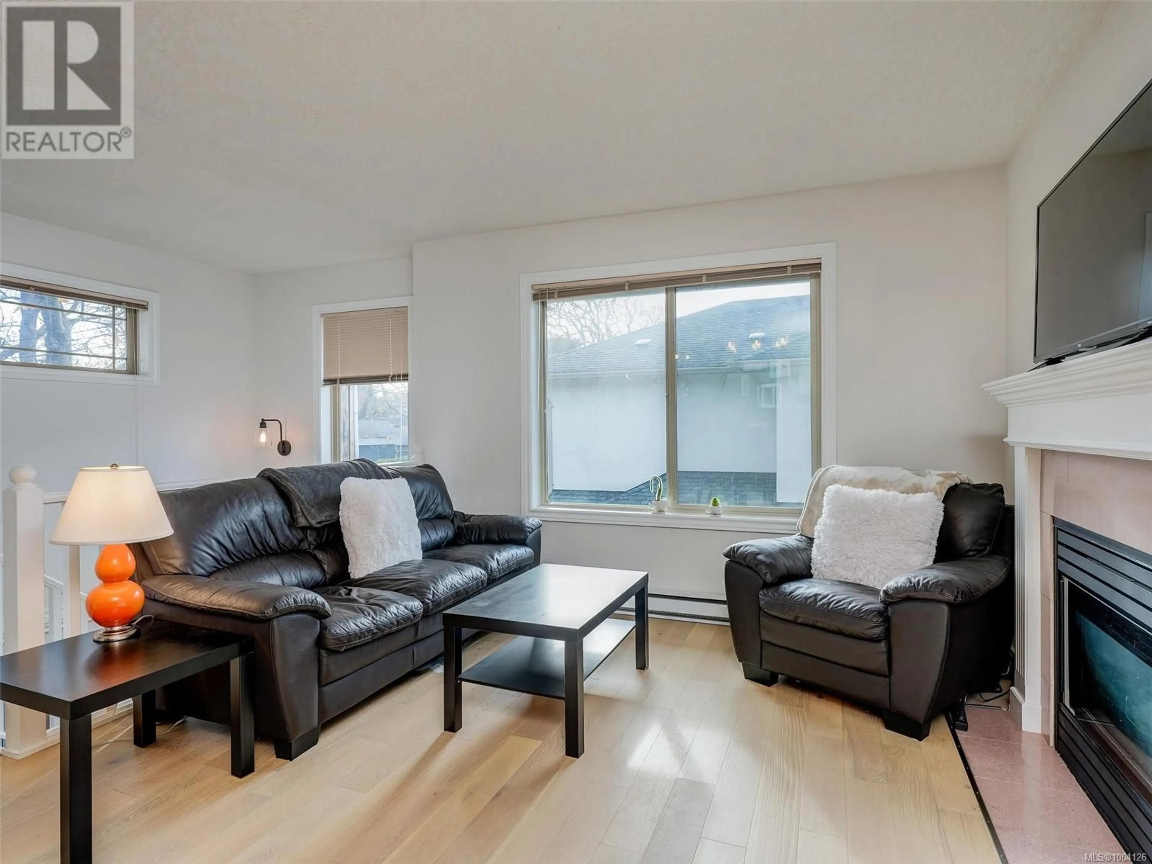 Living room with furniture, wood/laminate floor for 1 - 2720 SHELBOURNE STREET, Victoria British Columbia V8R4M2