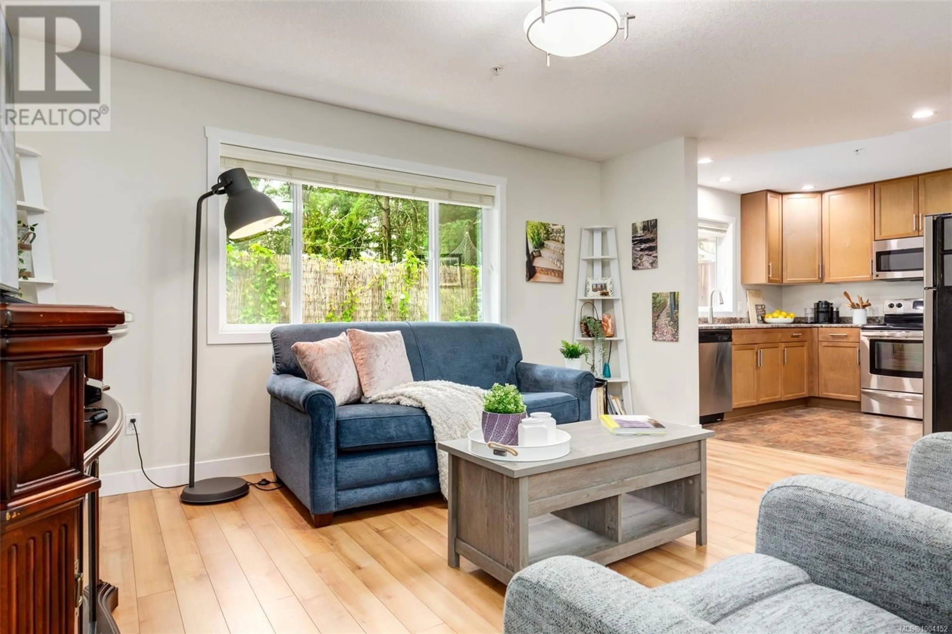 Living room with furniture, wood/laminate floor for 504 GARDASAN WAY, Nanaimo British Columbia V9R6K8