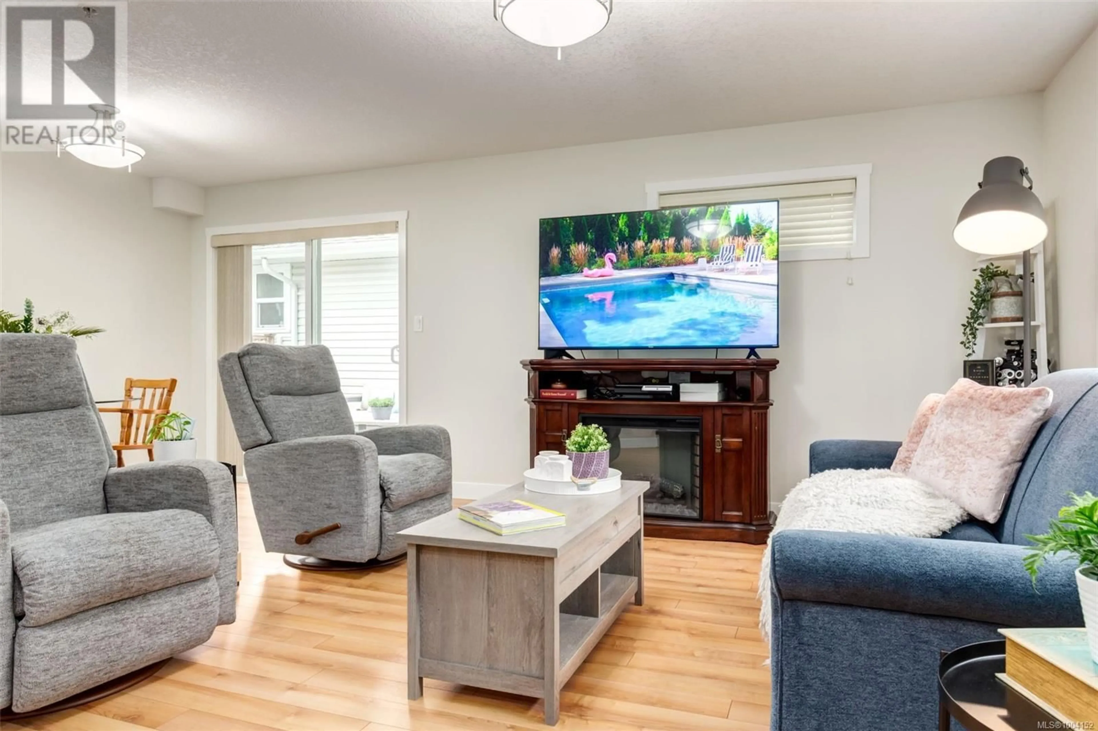 Living room with furniture, wood/laminate floor for 504 GARDASAN WAY, Nanaimo British Columbia V9R6K8