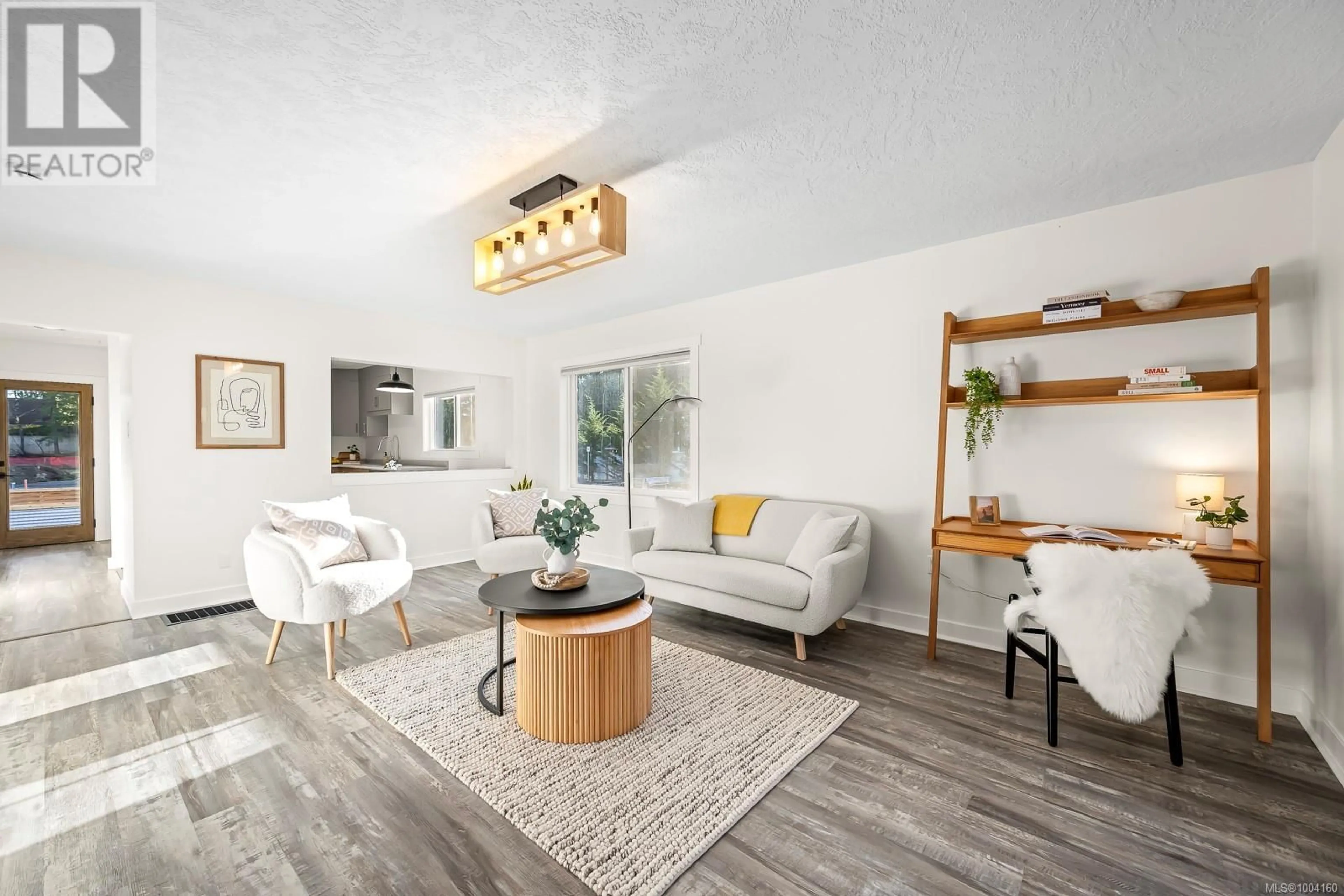 Living room with furniture, wood/laminate floor for SL3 - 4703 CUMBERLAND ROAD, Cumberland British Columbia V0R1S0