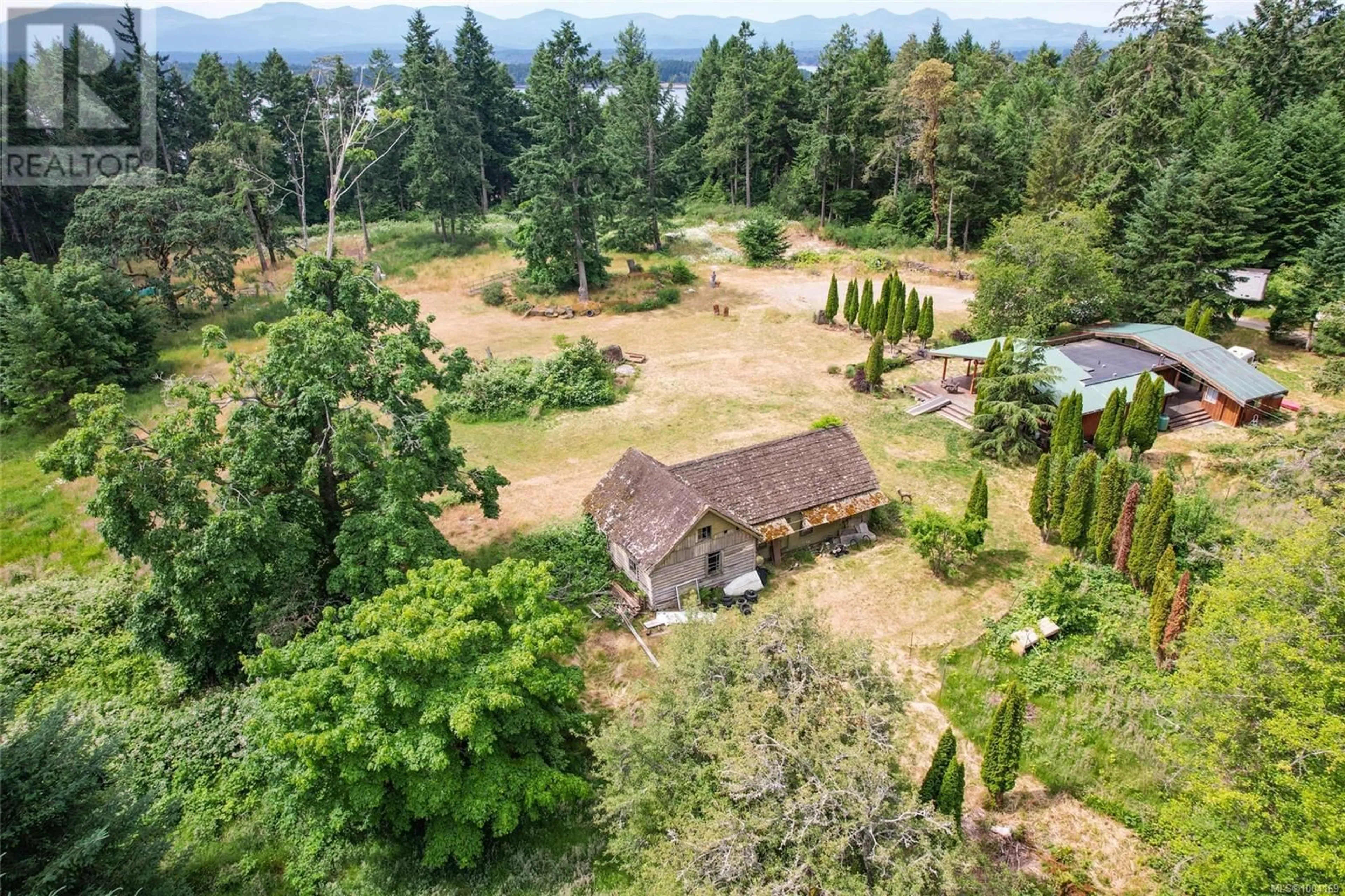 A pic from outside/outdoor area/front of a property/back of a property/a pic from drone, forest/trees view for 2411 SOUTH ROAD, Gabriola Island British Columbia V0R1X7