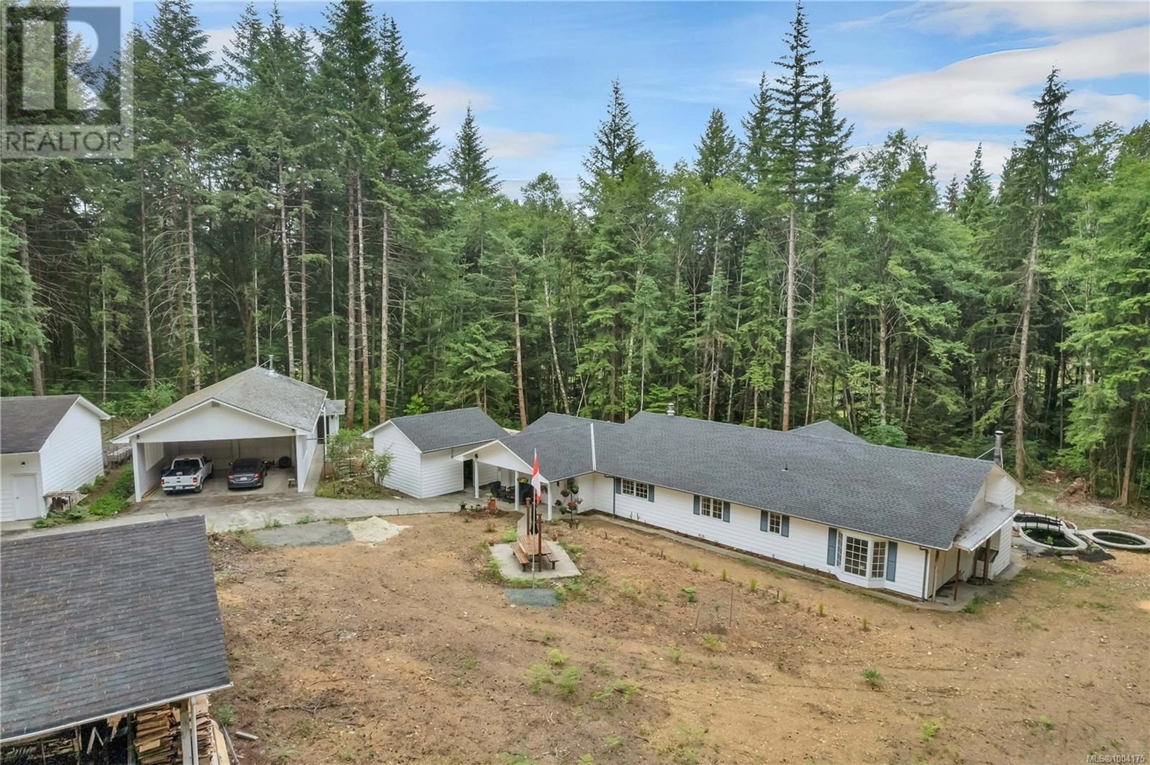 A pic from outside/outdoor area/front of a property/back of a property/a pic from drone, forest/trees view for 413 CAPE MUDGE ROAD, Quadra Island British Columbia V0P1N0