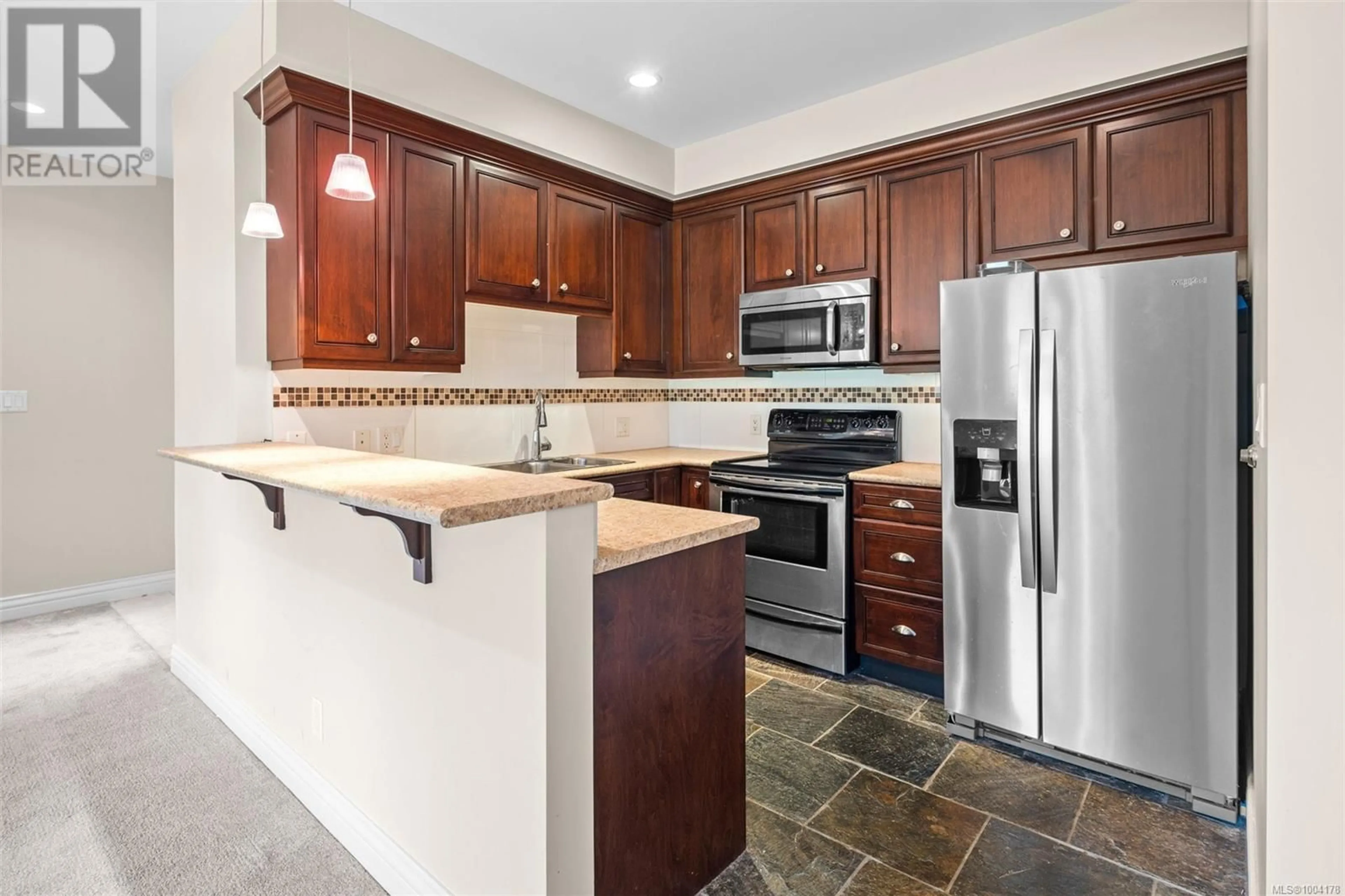 Standard kitchen, ceramic/tile floor for 311 - 1335 BEAR MOUNTAIN PARKWAY, Langford British Columbia V9B6T9